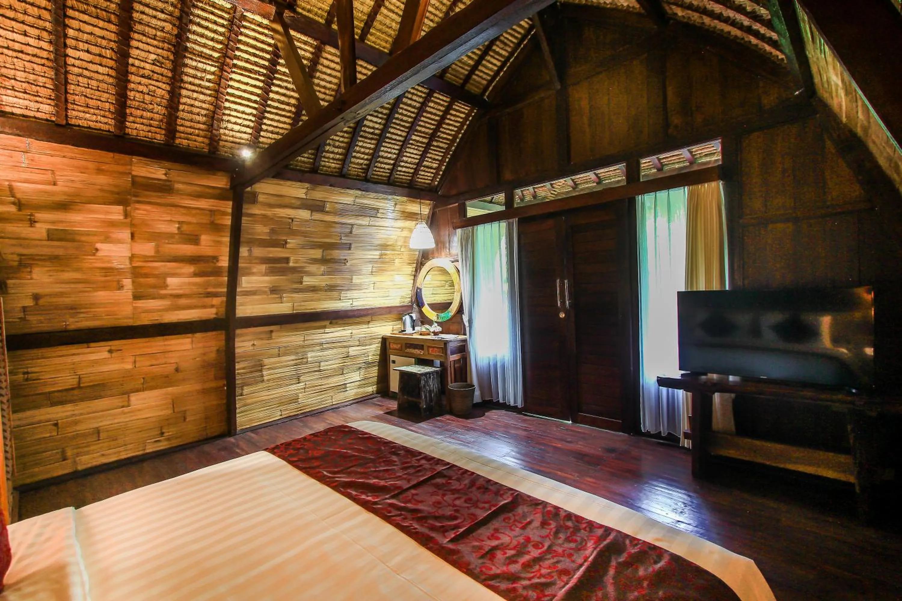 Living room, Bed in Keramas Sacred River Retreat Resort and Villa