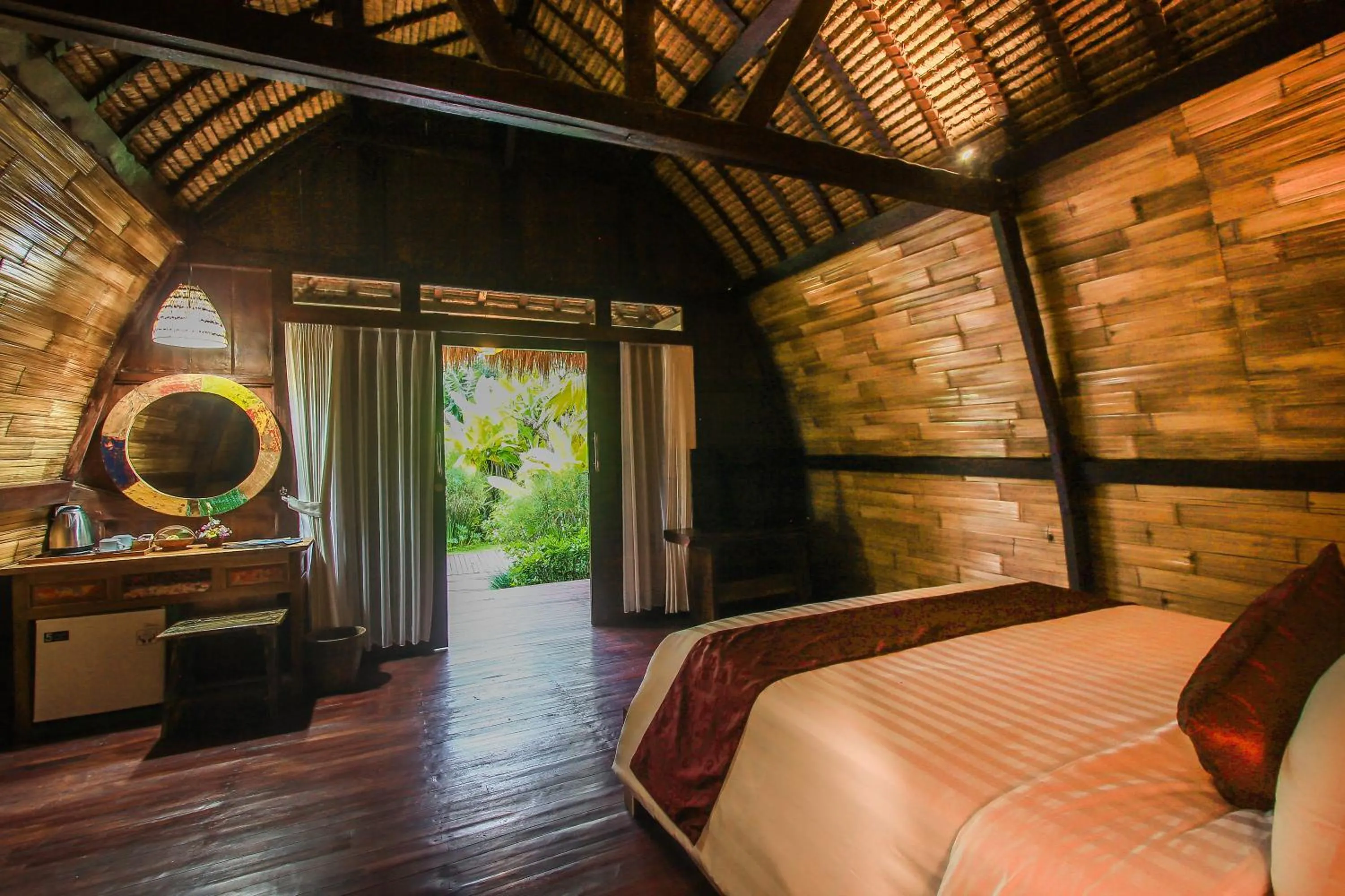 Photo of the whole room, Bed in Keramas Sacred River Retreat Resort and Villa