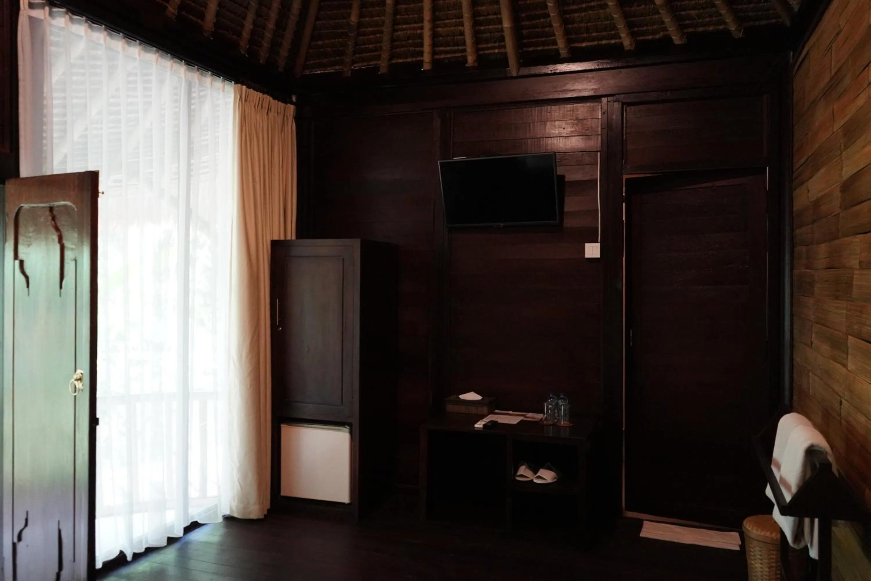TV and multimedia in Keramas Sacred River Retreat Resort and Villa