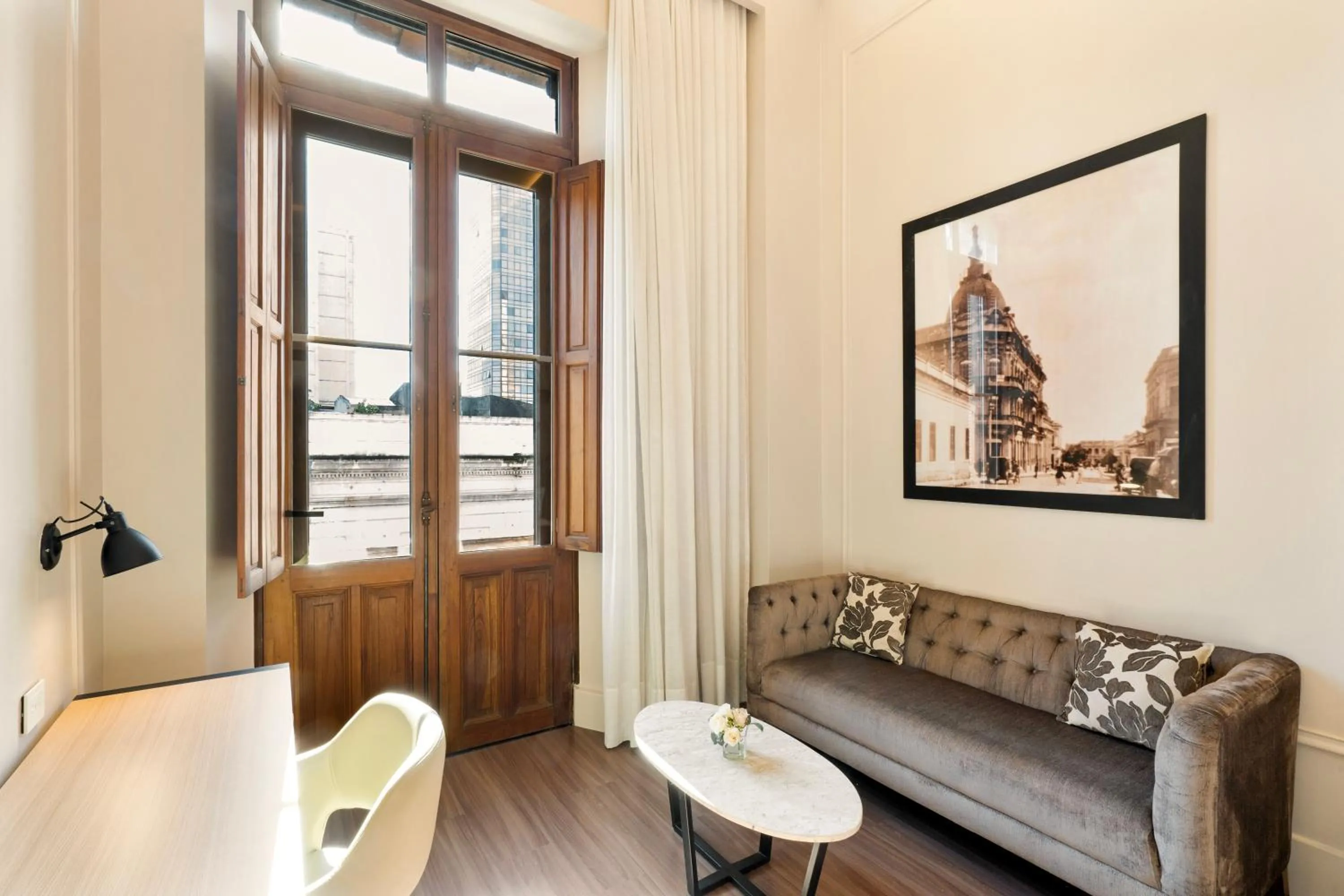 Living room in Palmaroga Hotel Asuncion, Tapestry Collection by Hilton