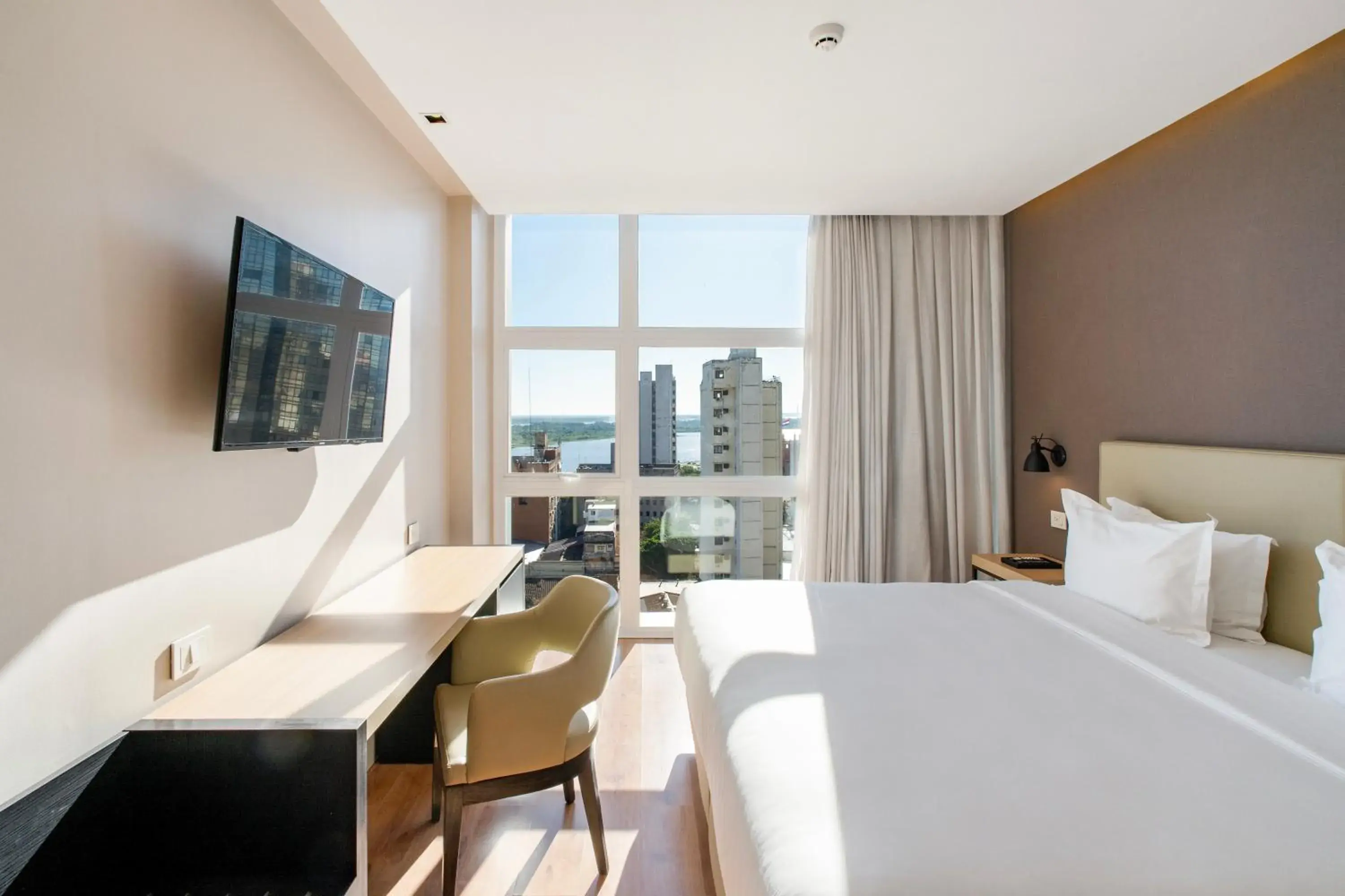 River view, Bed in Palmaroga Hotel Asuncion, Tapestry Collection by Hilton River view, Bed in Palmaroga Hotel Asuncion, Tapestry Collection by Hilton