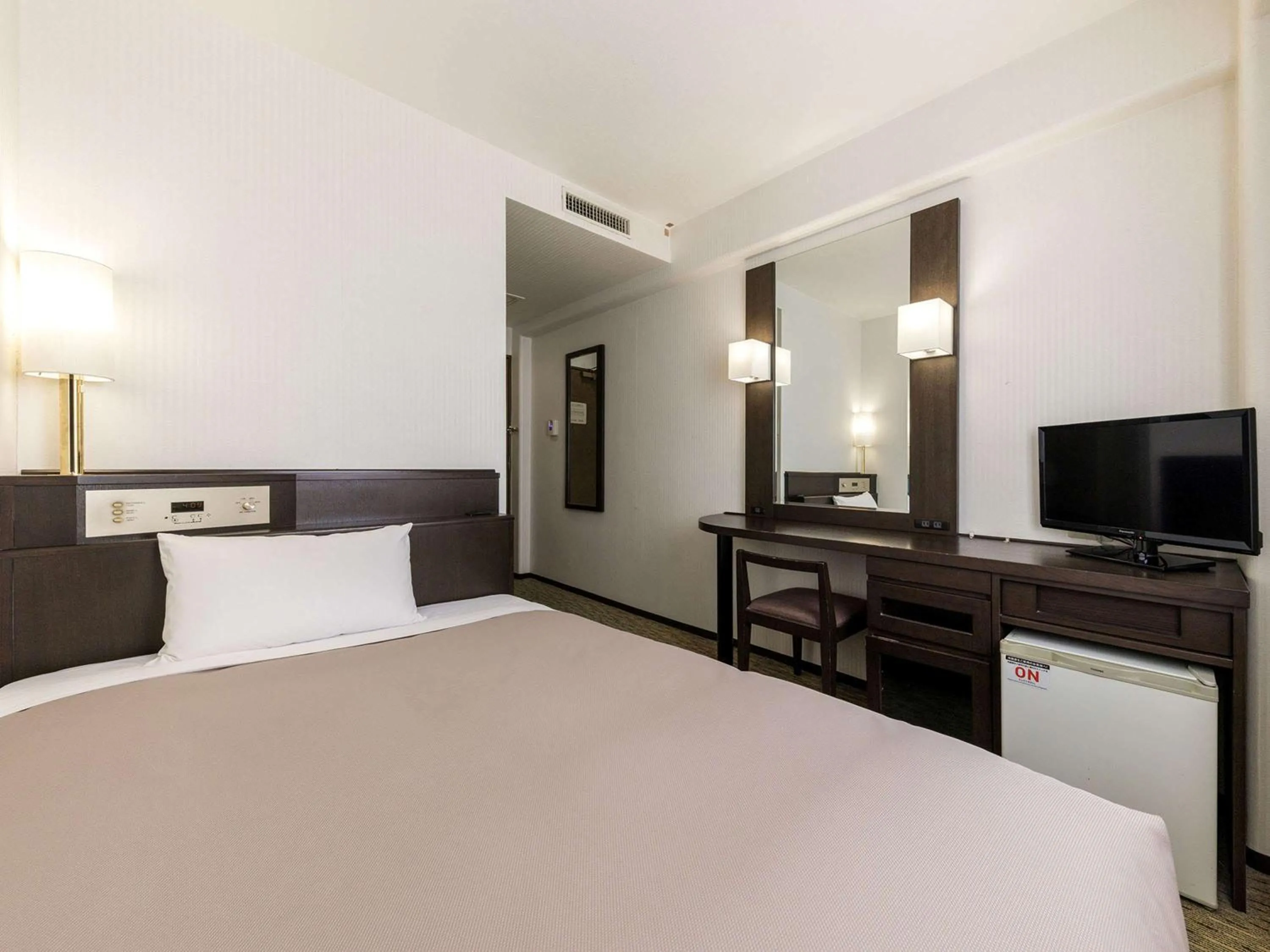 Bed in Nishitetsu Inn Kokura