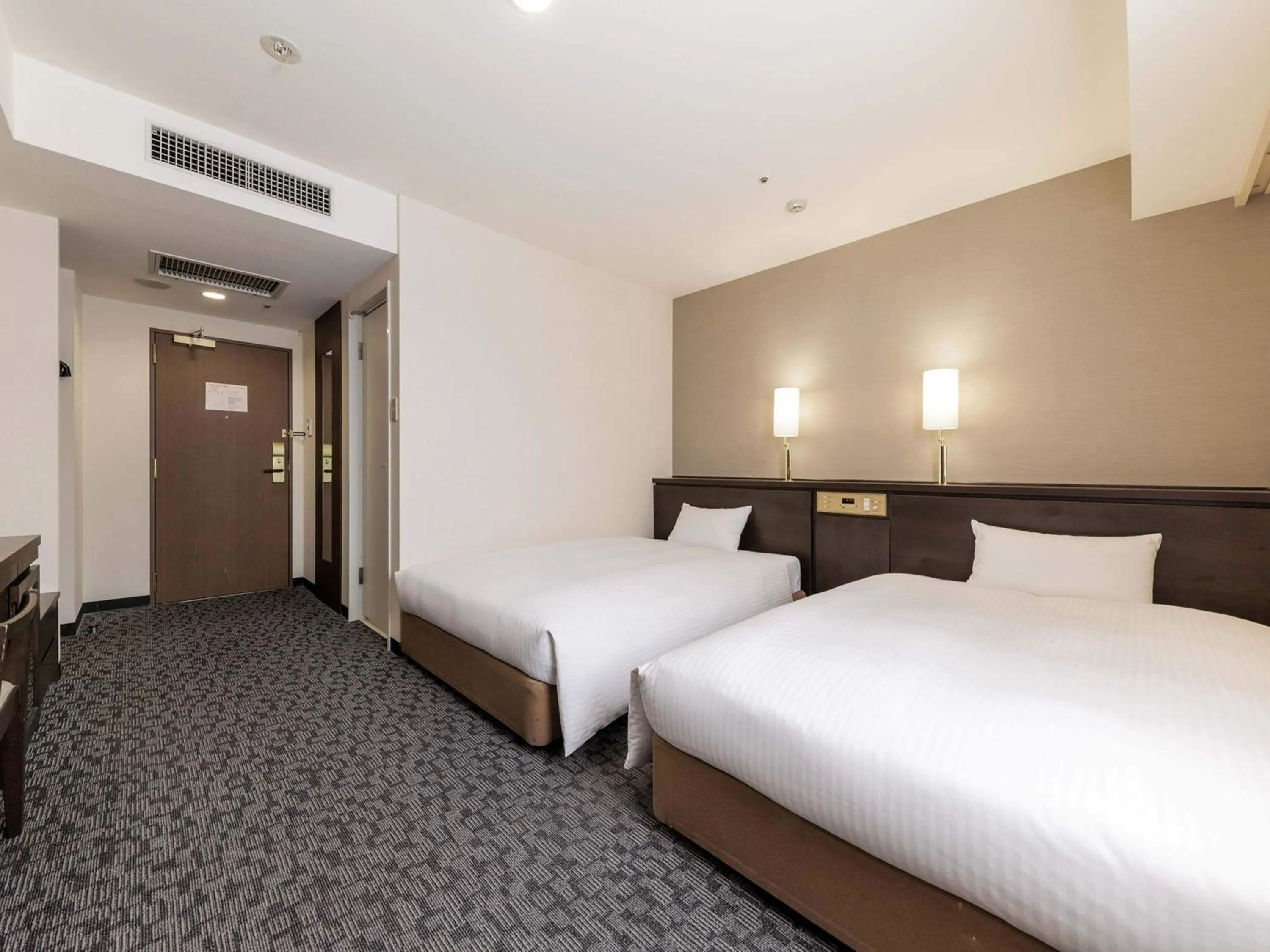 Bed in Nishitetsu Inn Kokura