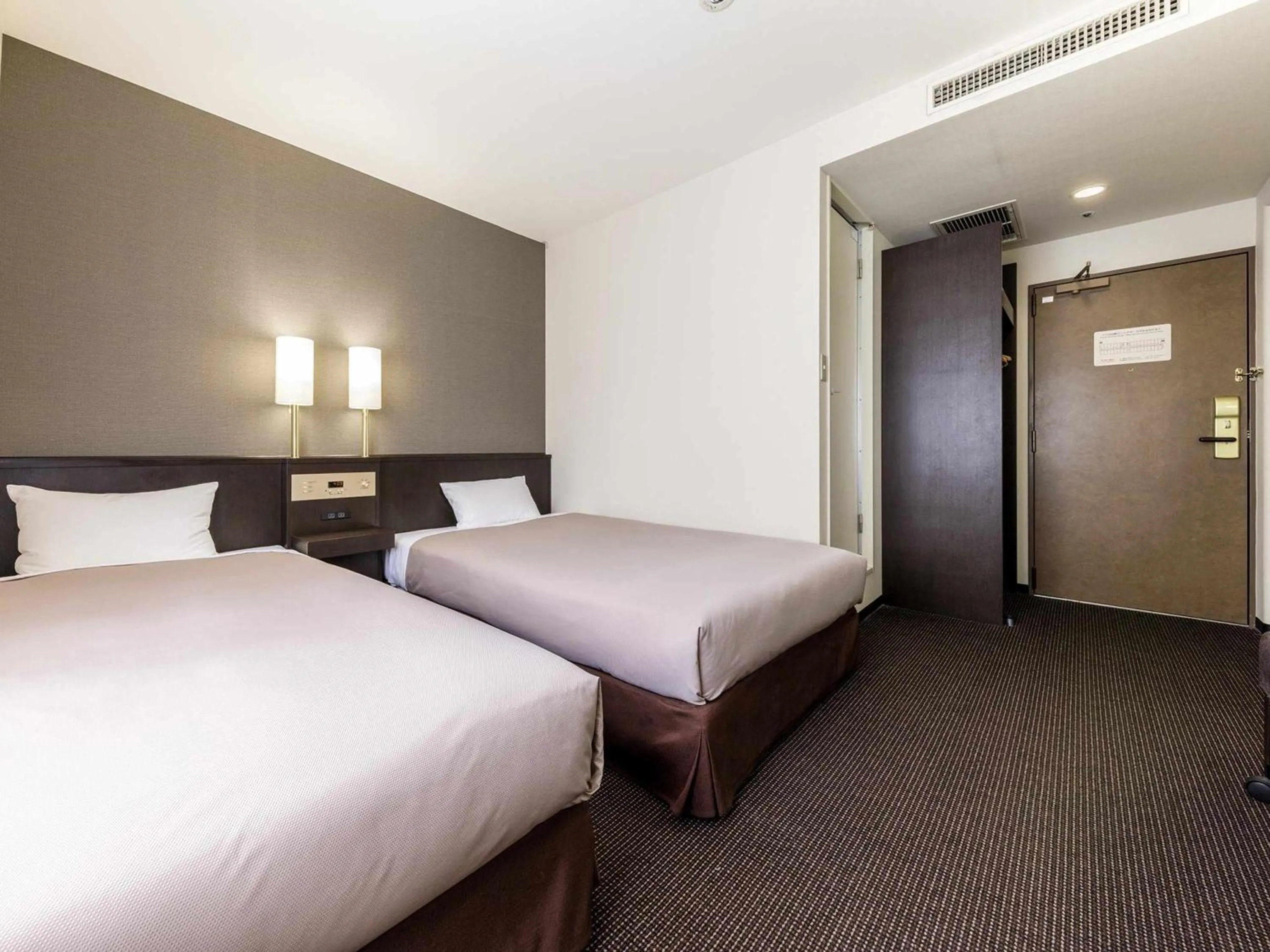 Bed in Nishitetsu Inn Kokura