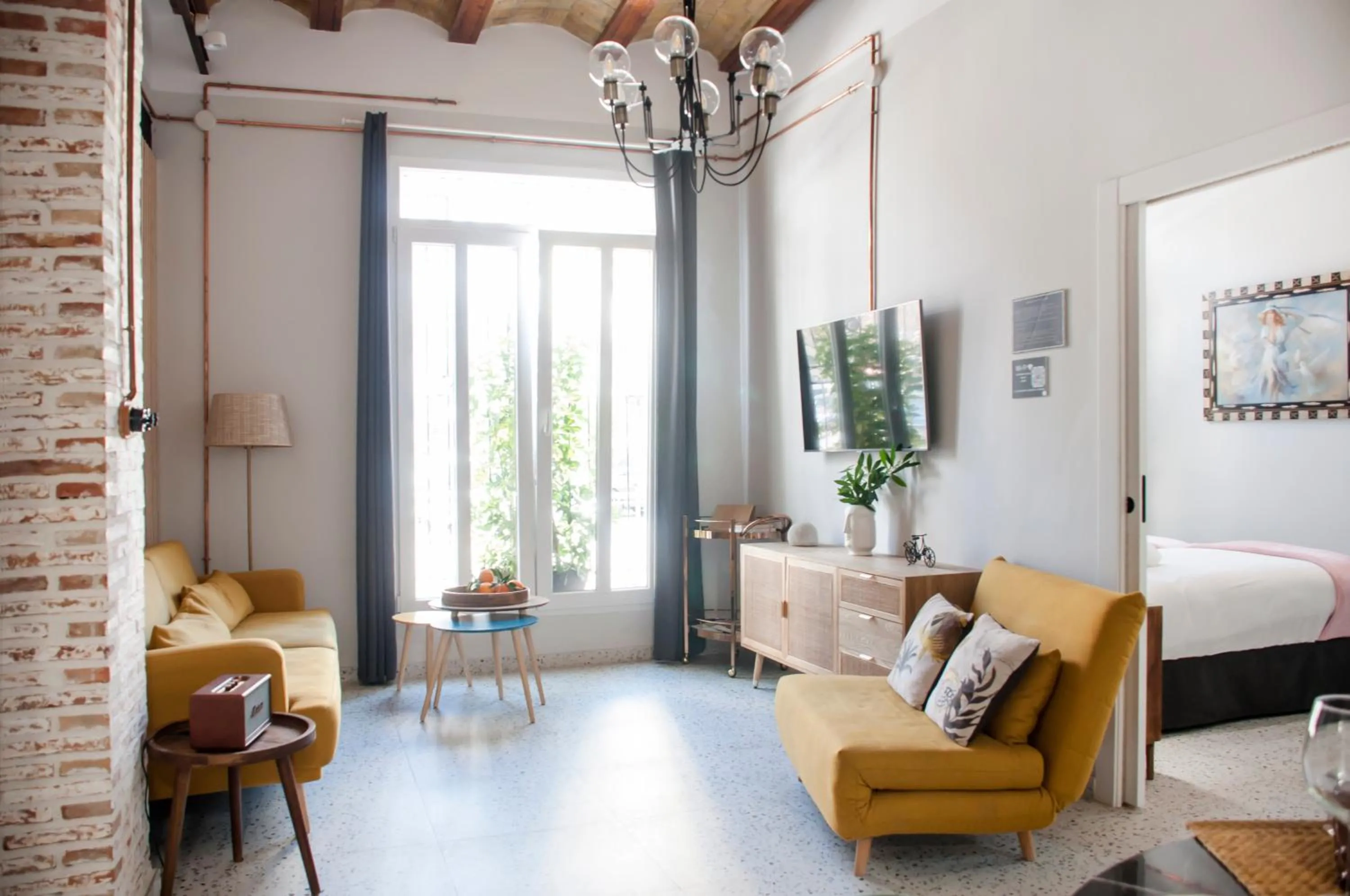 Living room, Bed in Valencia Apartamentos Goya