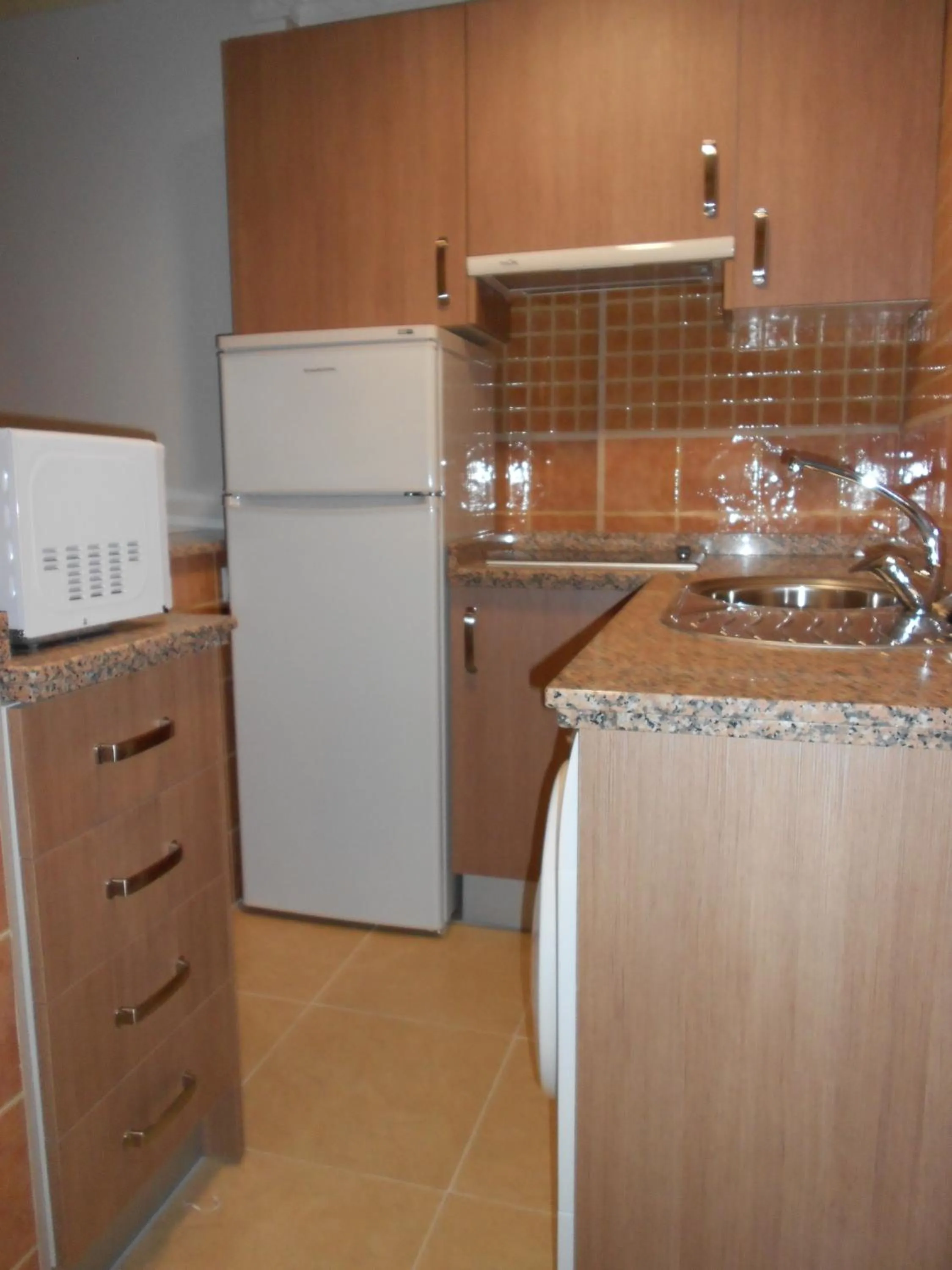 Kitchen or kitchenette in Apartamentos Turisticos Las Yucas