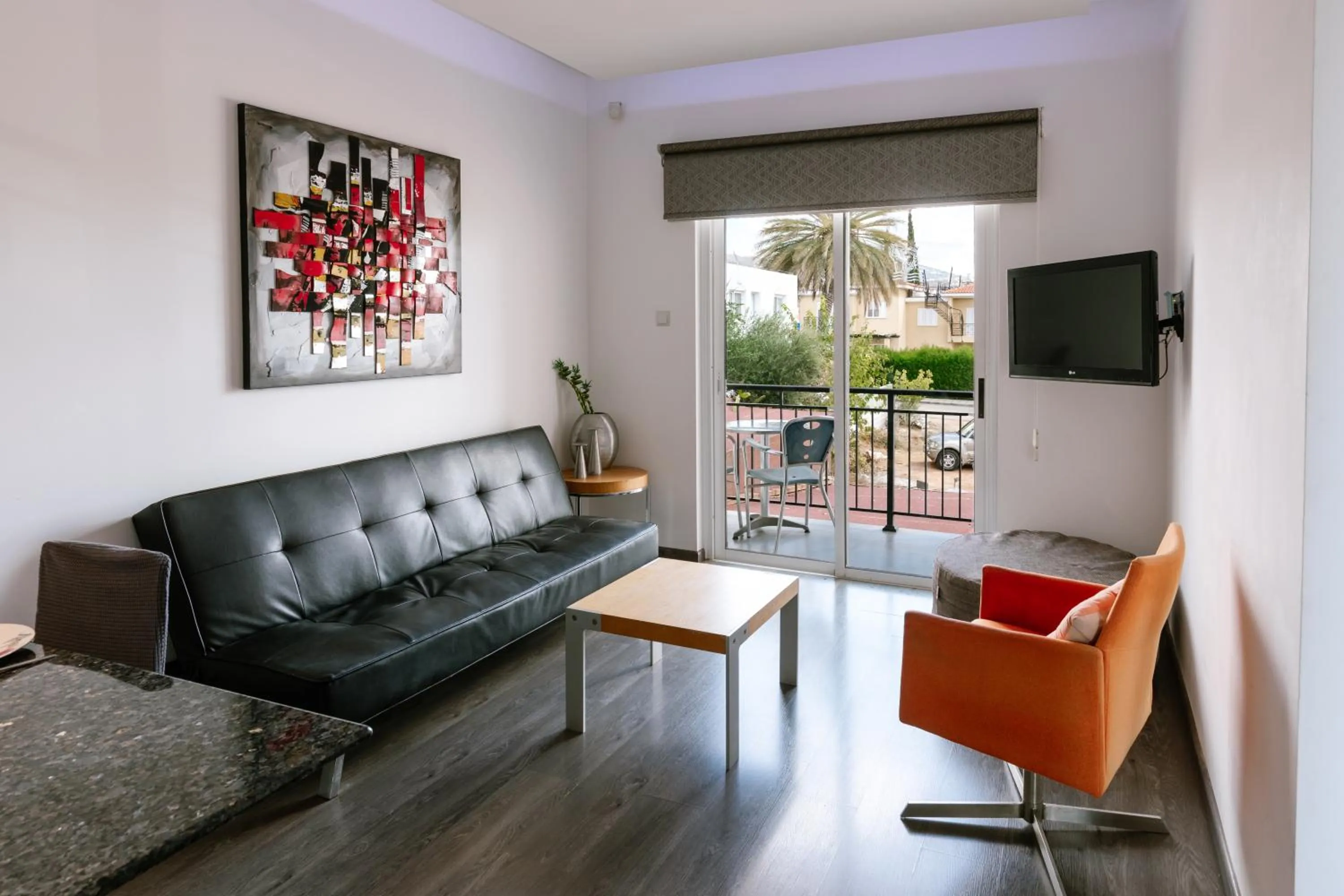 Communal lounge/ TV room in Neptune Hotel Apartments Paphos