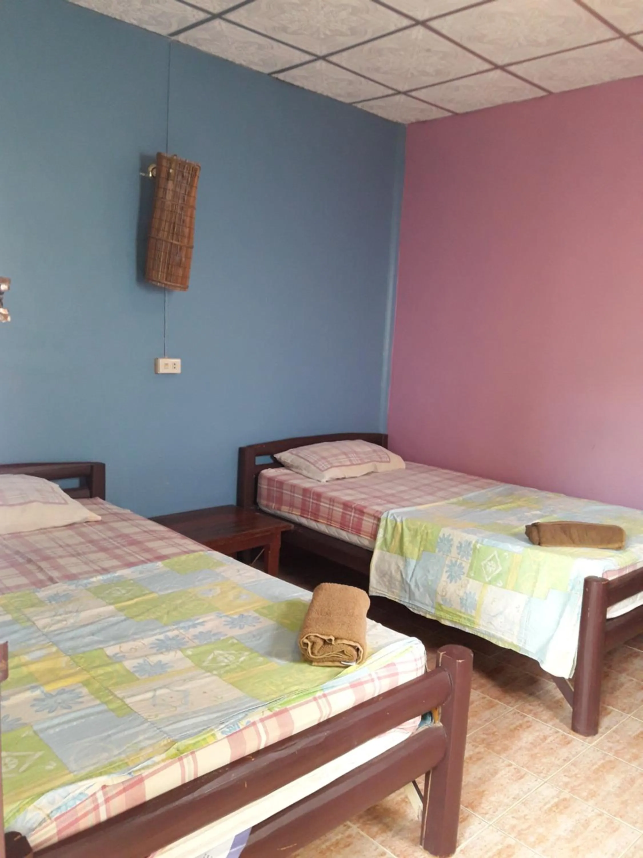 Bed in Jungle Hut Bungalows & Hotel