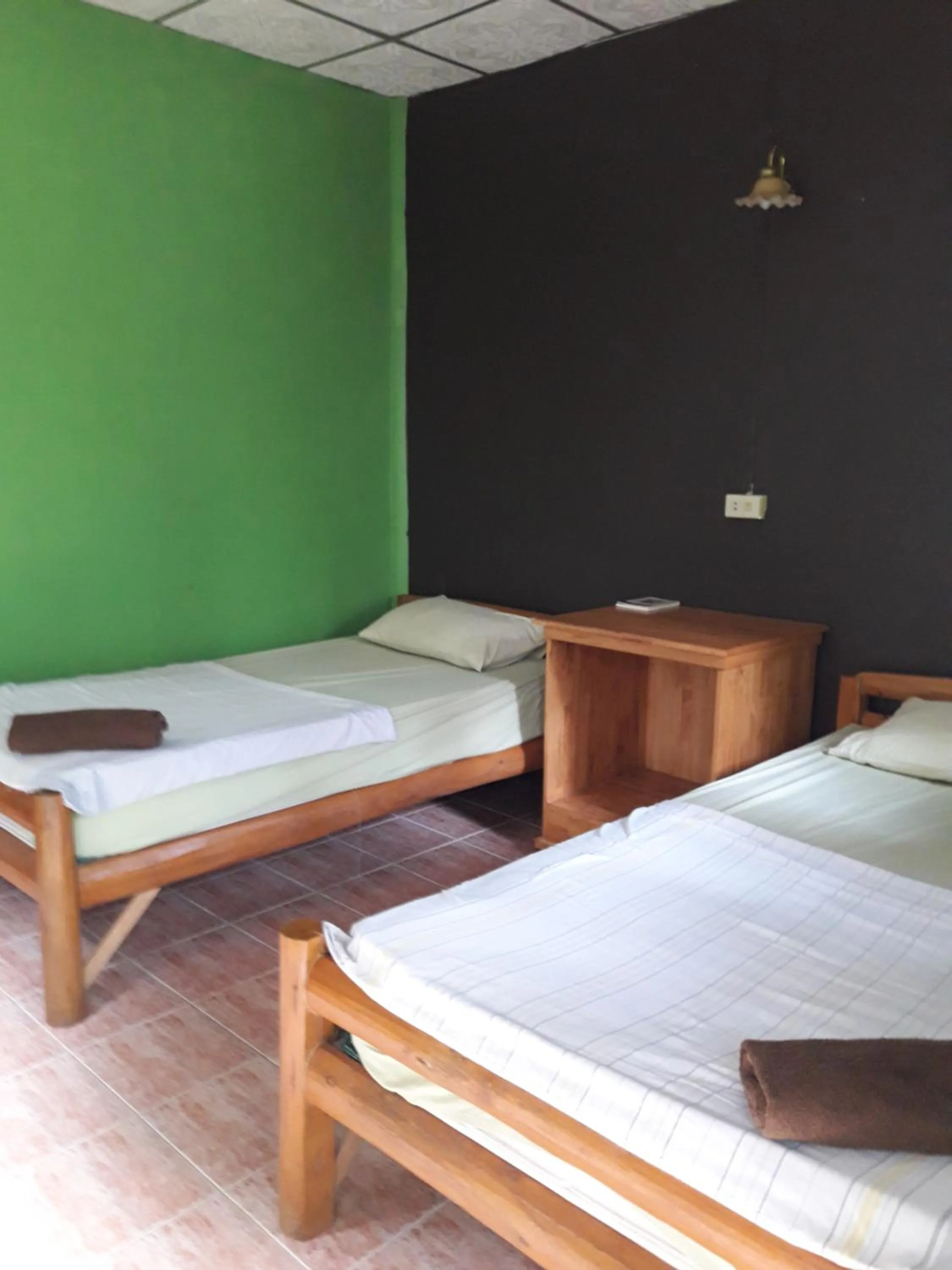 Bed in Jungle Hut Bungalows & Hotel