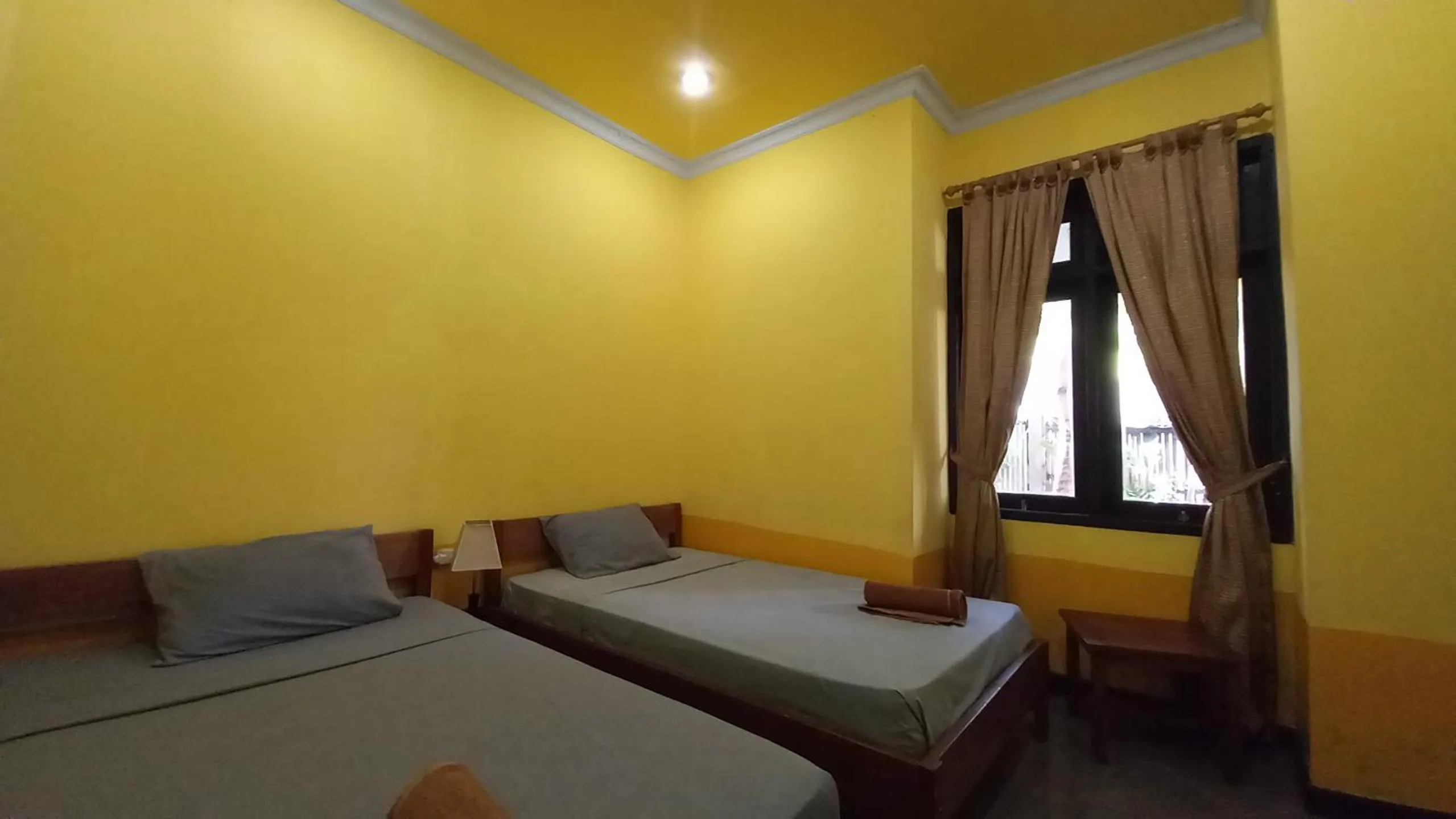 Bed in Gili Welldone Guesthouse