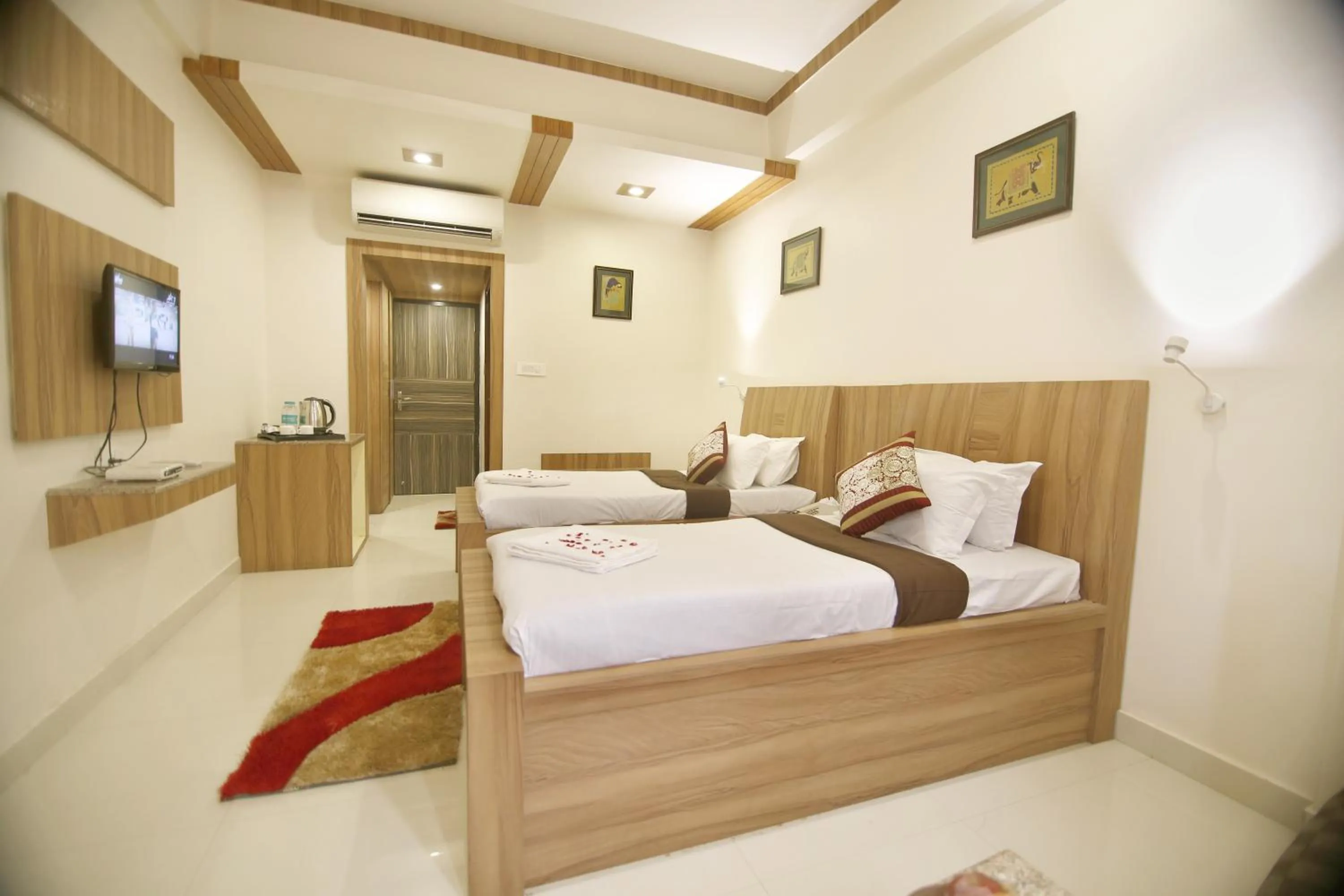 Bedroom, Bed in Hotel Sheetal Regency,Near Janambhumi