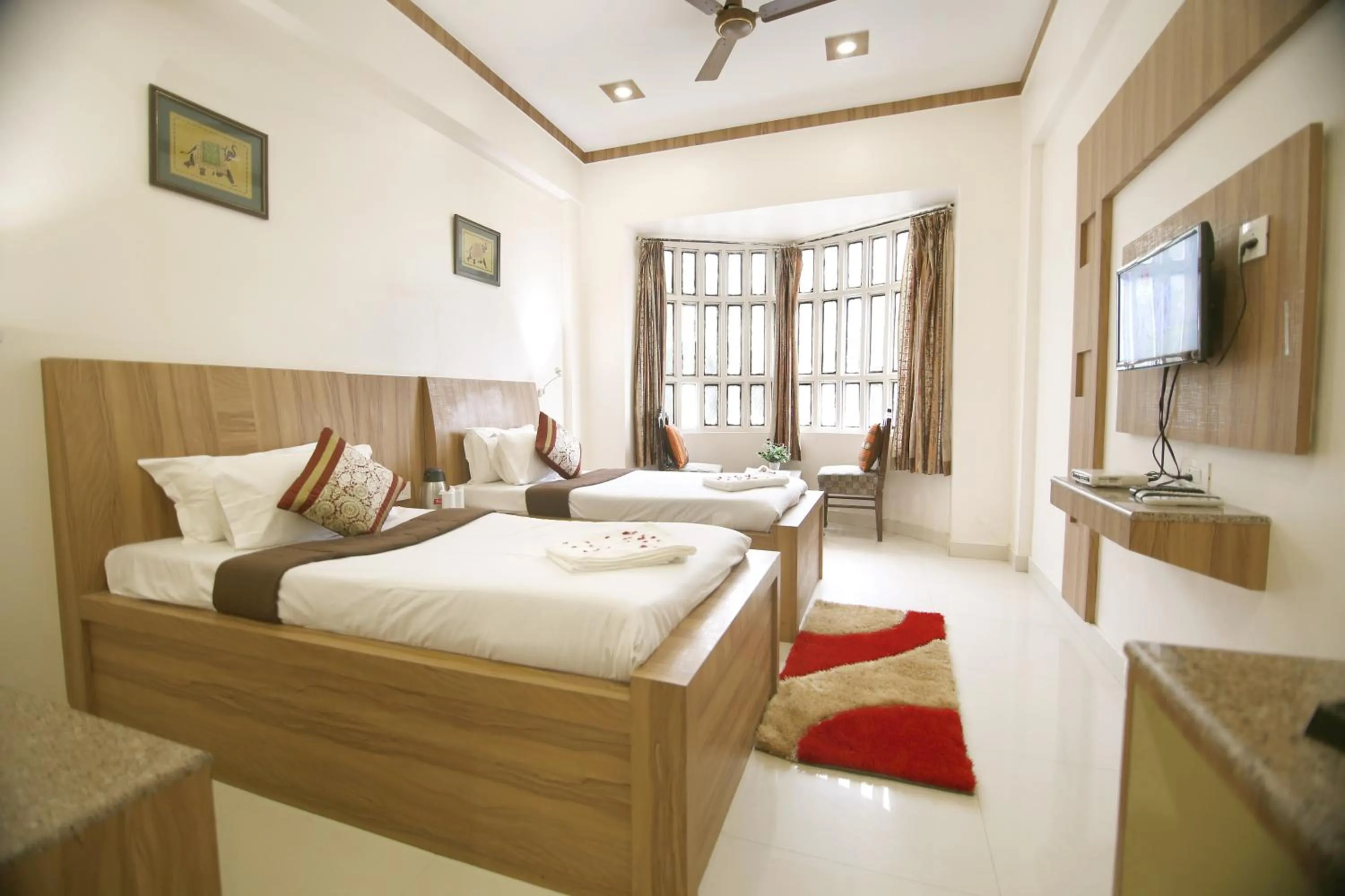 Bedroom, Bed in Hotel Sheetal Regency,Near Janambhumi