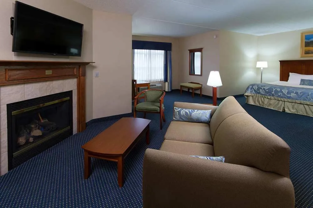 Seating area, Bed in Wingate by Wyndham Ellicottville