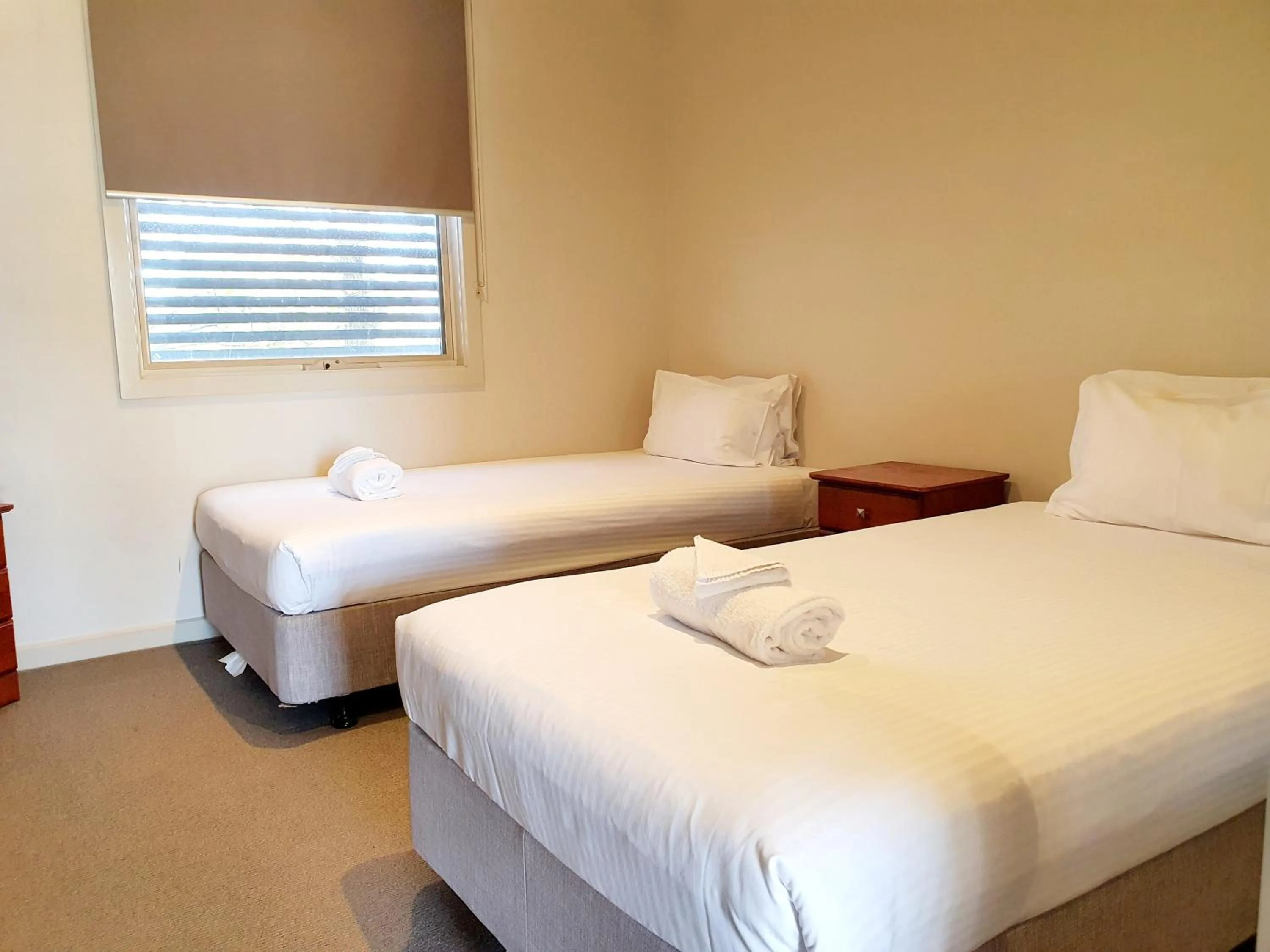 Bed in Central Shepparton Apartments