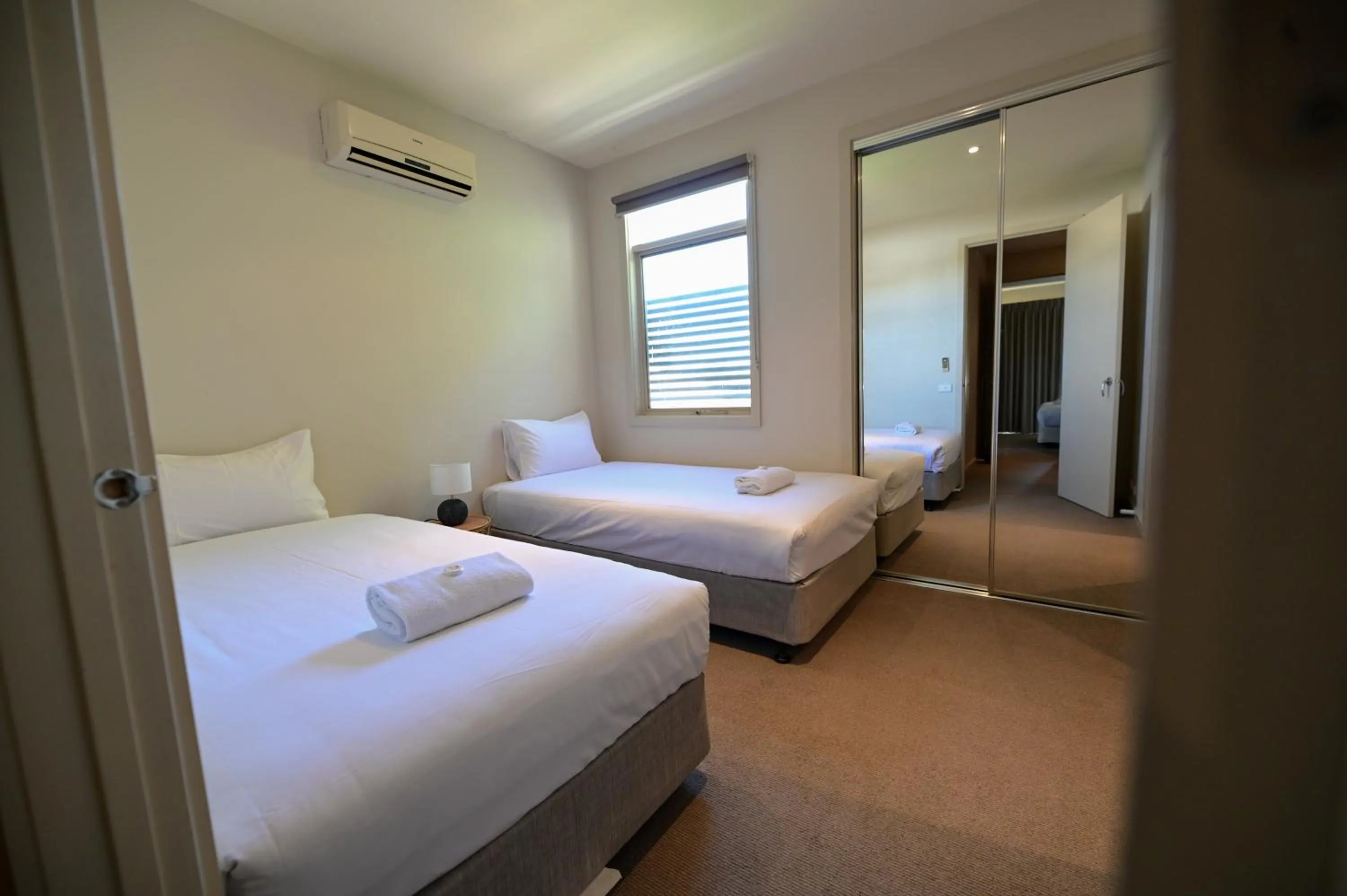 Bed in Central Shepparton Apartments