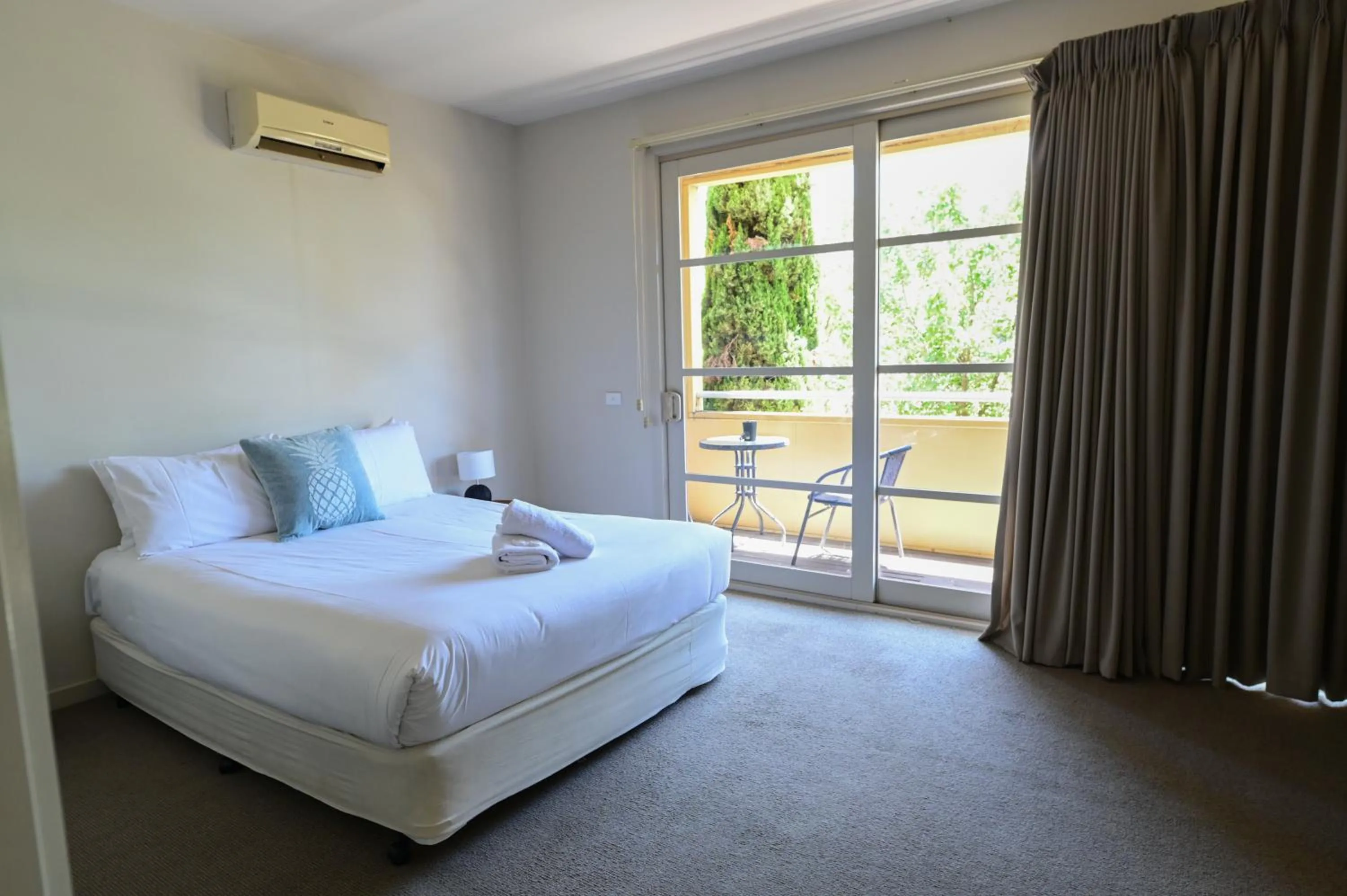 Bed in Central Shepparton Apartments