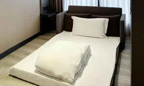 Bed in The Tango Hotel Taipei Jiantan Bed in The Tango Hotel Taipei Jiantan