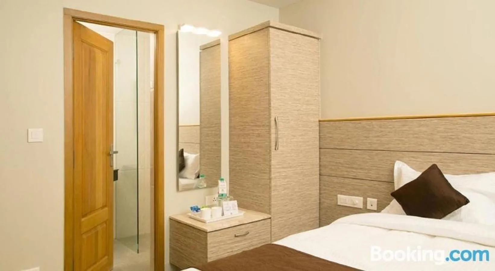 Photo of the whole room, Bed in Sri Aadhish Grand Hotel