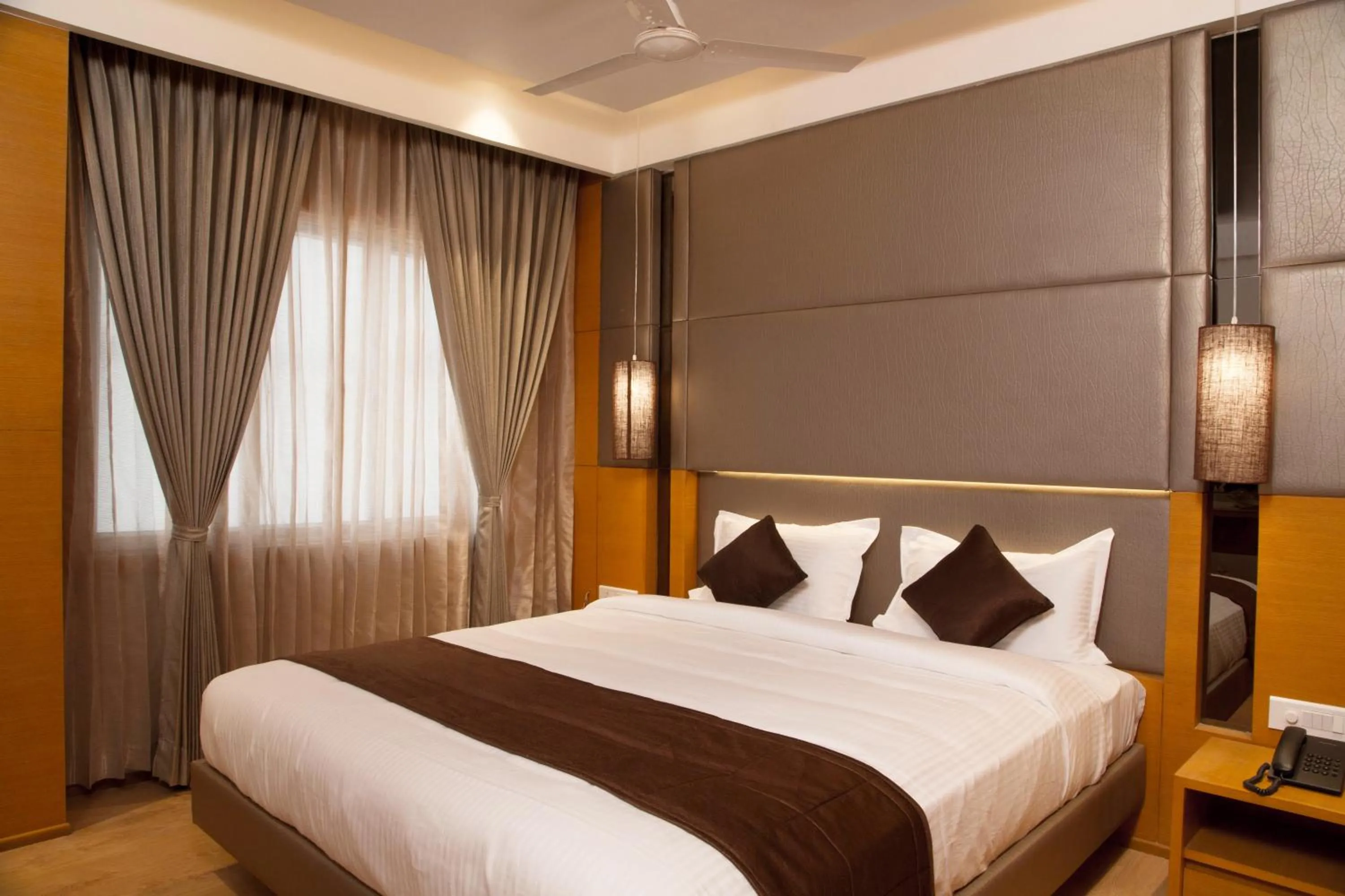 Bed in Sri Aadhish Grand Hotel