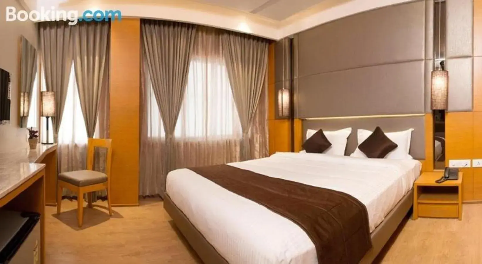 Bed in Sri Aadhish Grand Hotel Bed in Sri Aadhish Grand Hotel