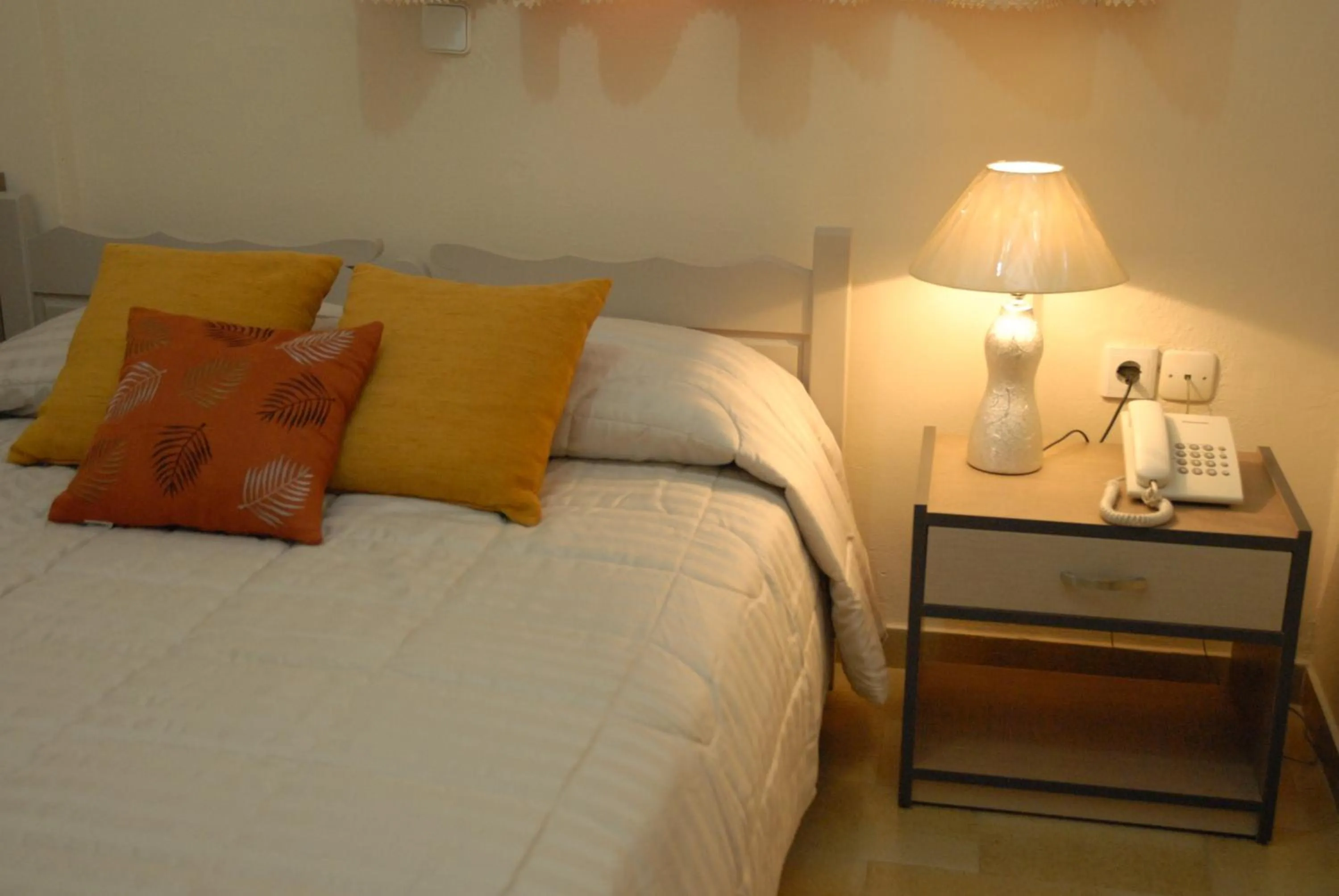 Bed in Takis Hotel Apartments