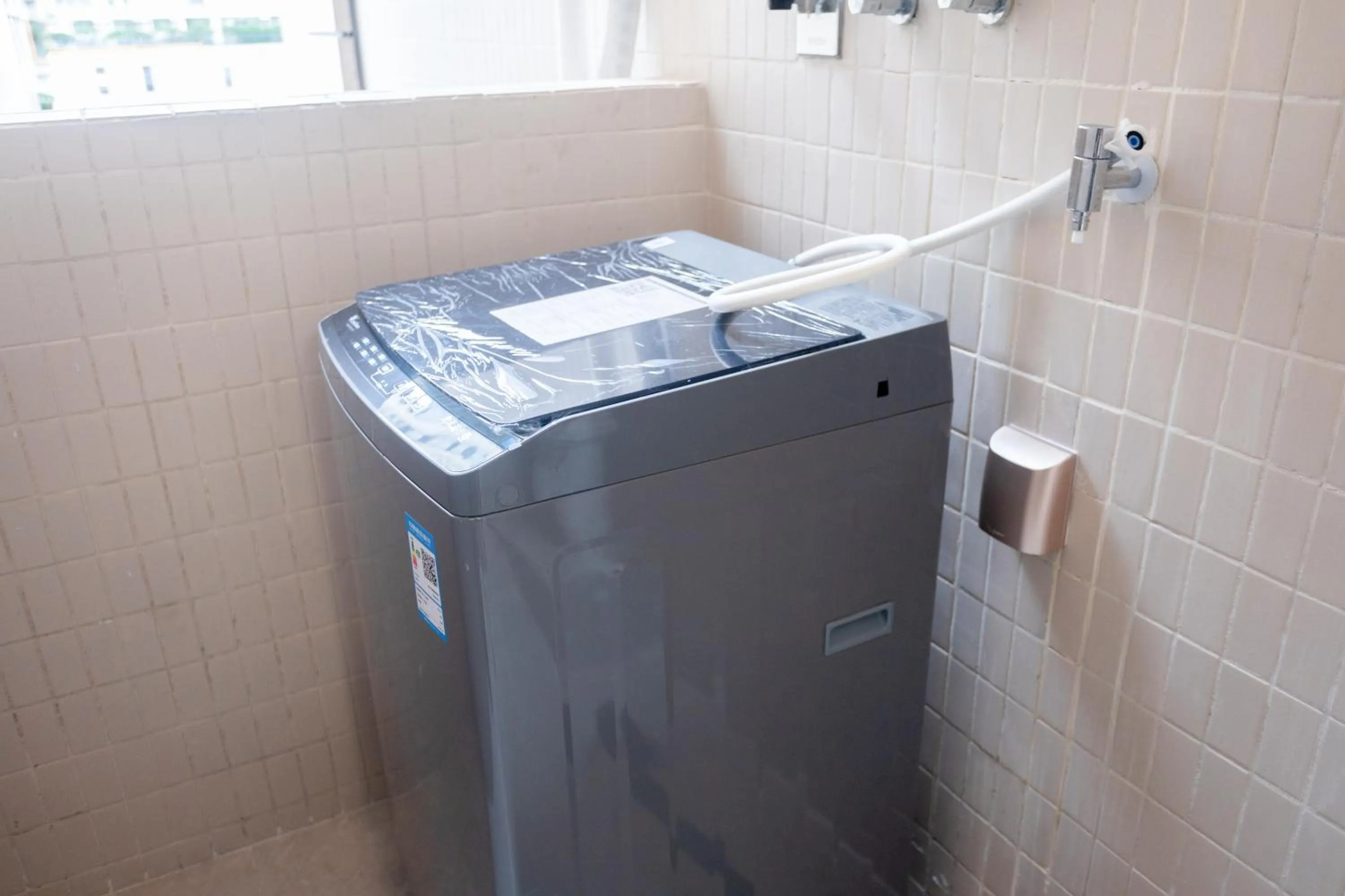 washing machine in Sunny International Apartment From Beijing Road