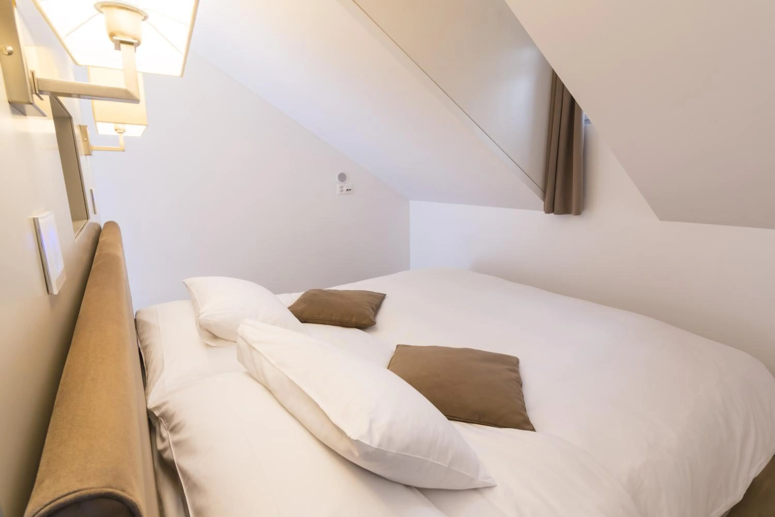 Bed in Swiss Luxury Apartments Geneva