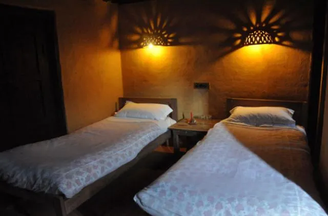 Photo of the whole room, Bed in Gaun Ghar Pvt Ltd