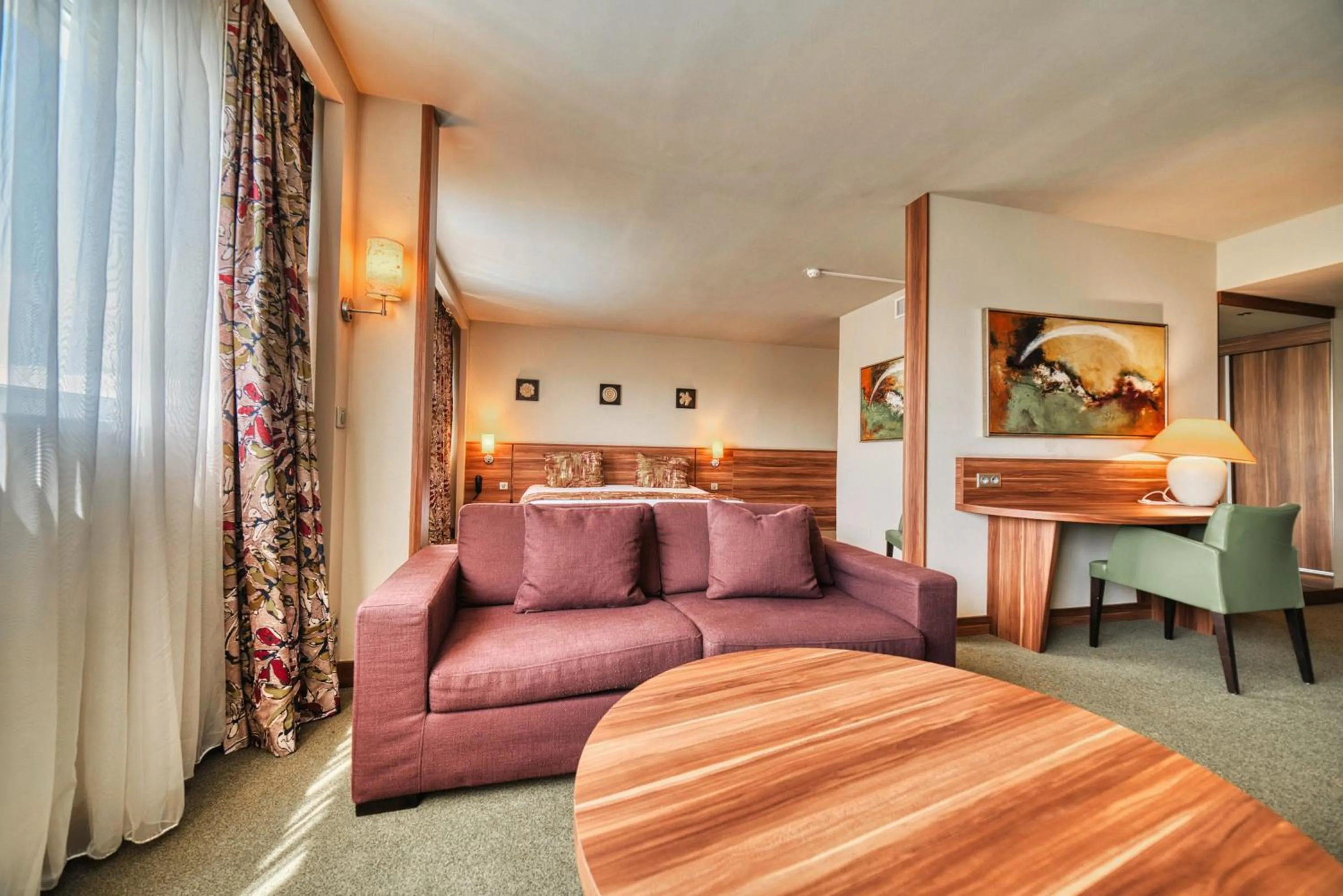 Living room, Bed in Kyriad Prestige Mulhouse - Basel