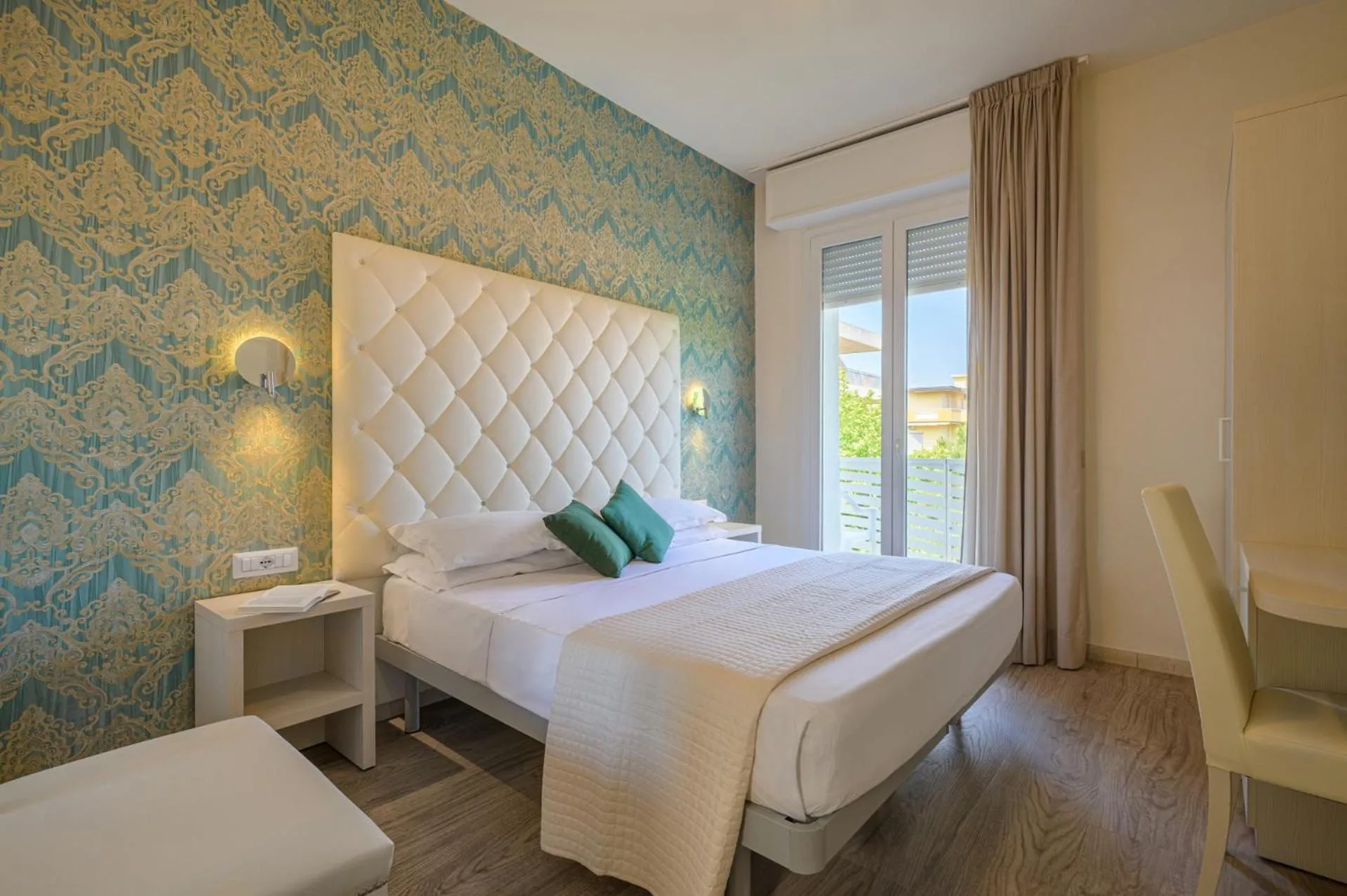 Bed in Hotel Acquamarina