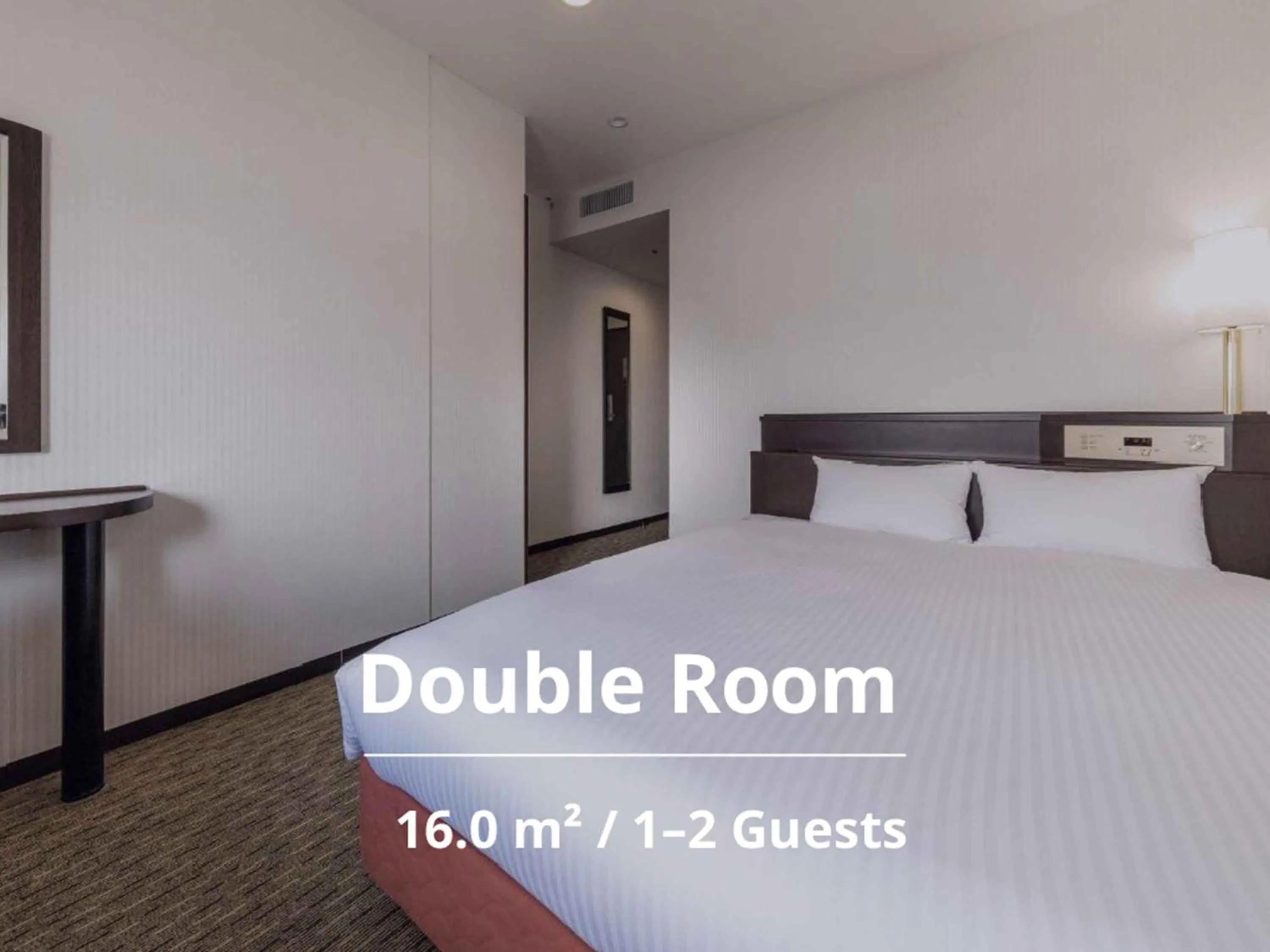 Photo of the whole room, Bed in Nishitetsu Inn Kurosaki