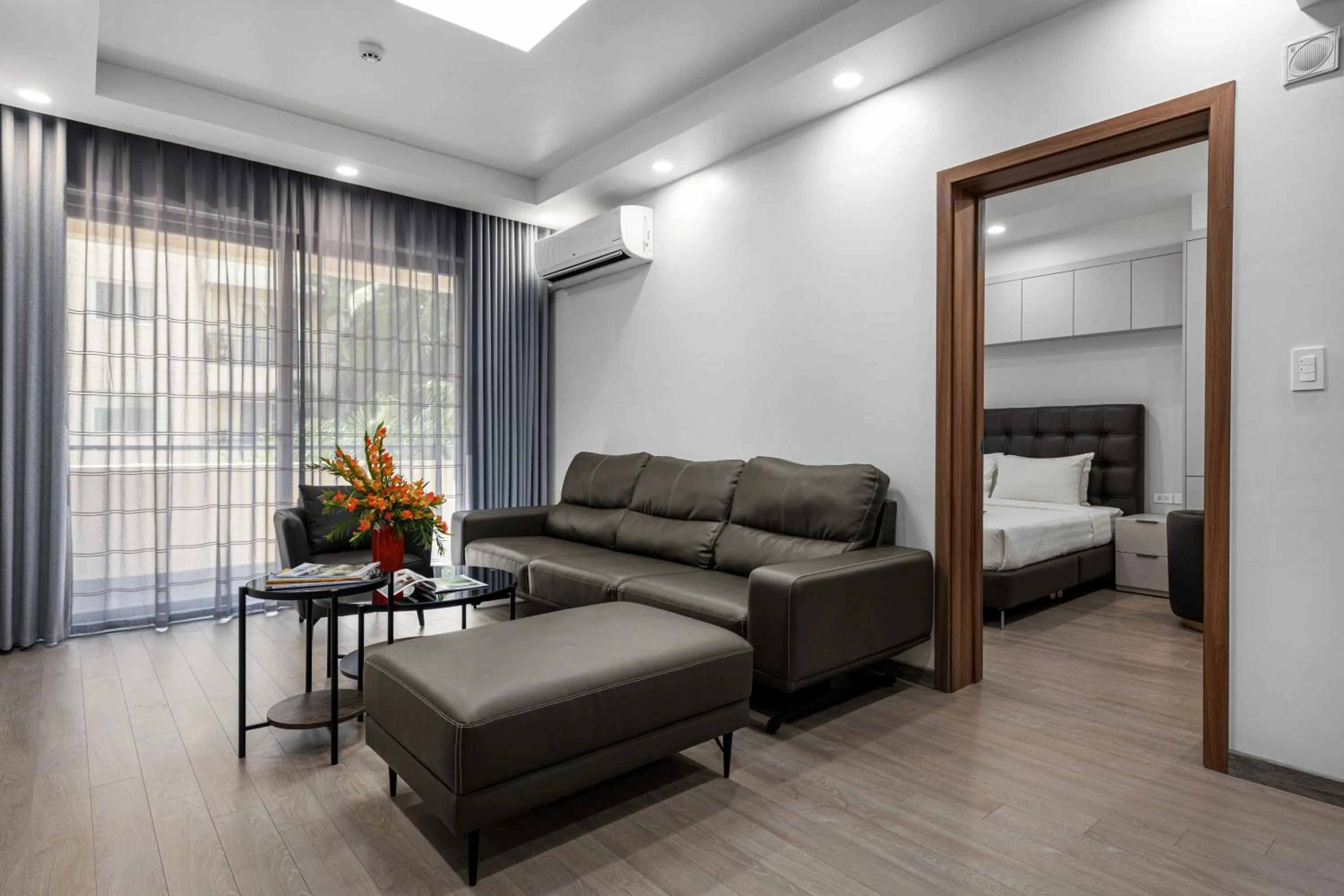 Living room, Bed in Sunflower Hotel & International Village