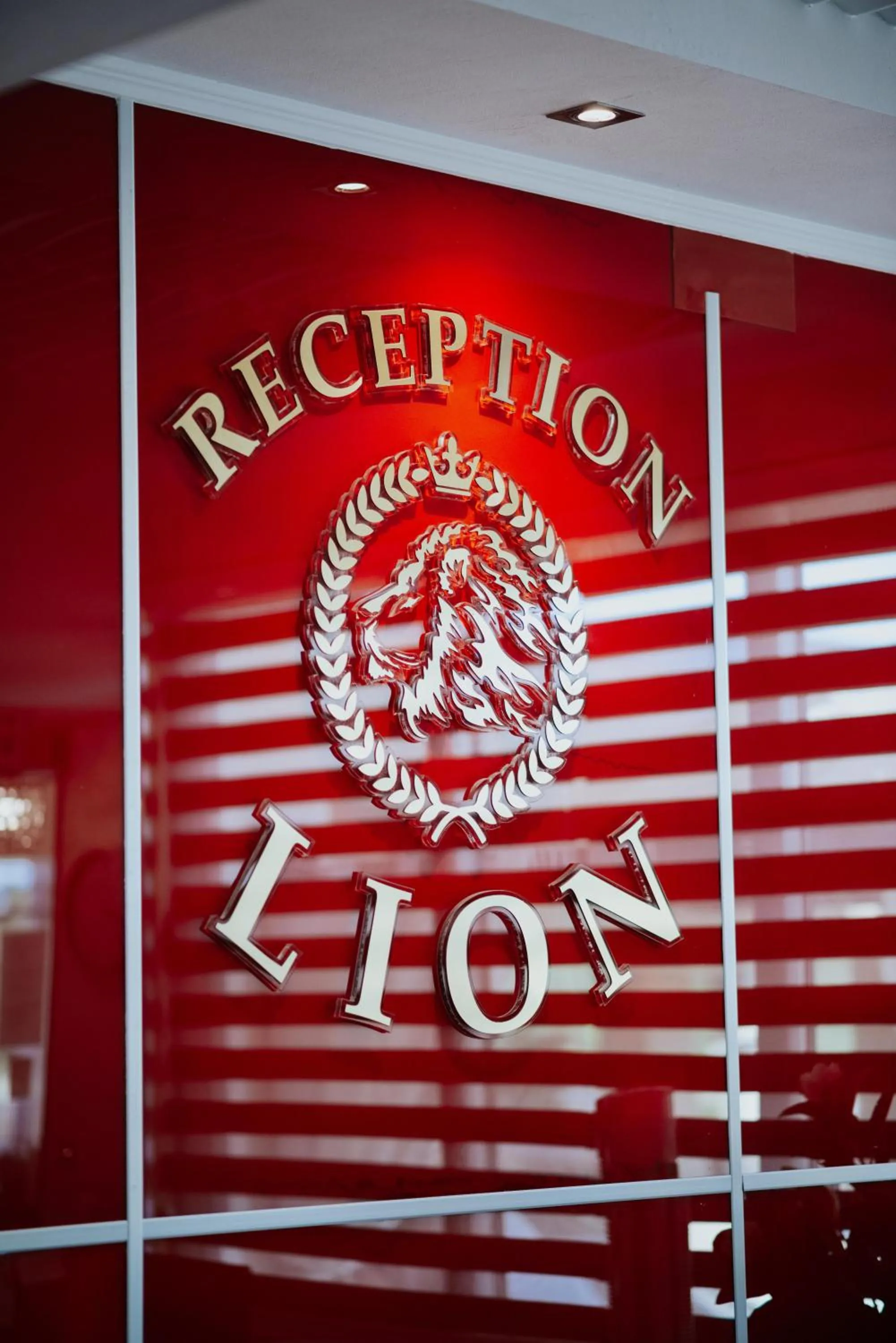 Property logo or sign in Hotel Lion