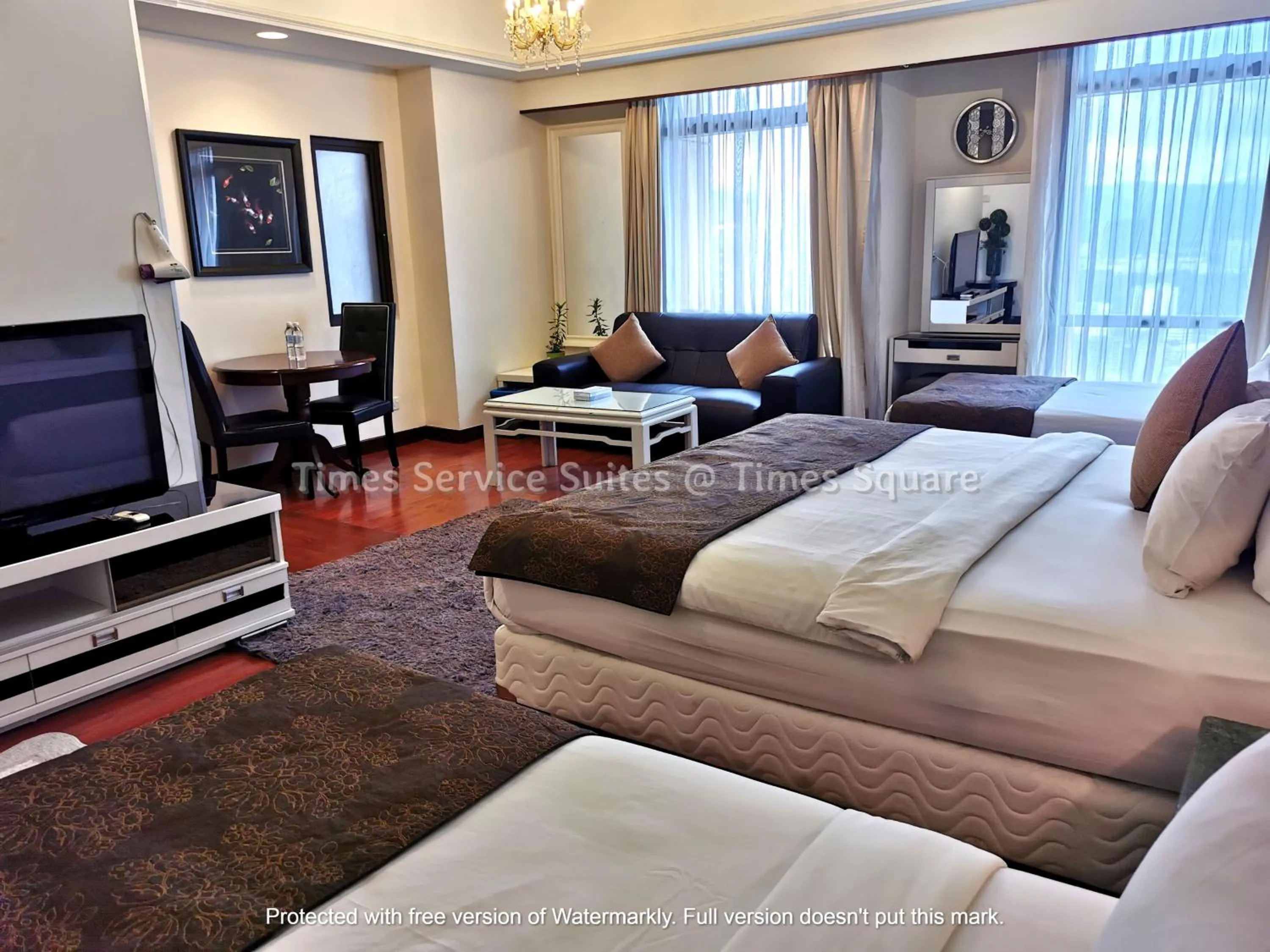 Living room, Bed in Times Service Suites @ Times Square