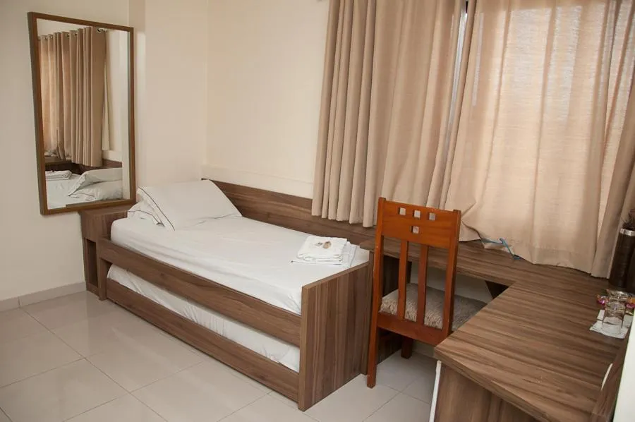 Bed in Plaza Suite Hotel