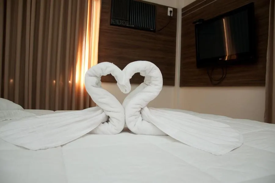 Bed in Plaza Suite Hotel