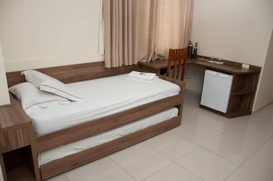 Bed in Plaza Suite Hotel