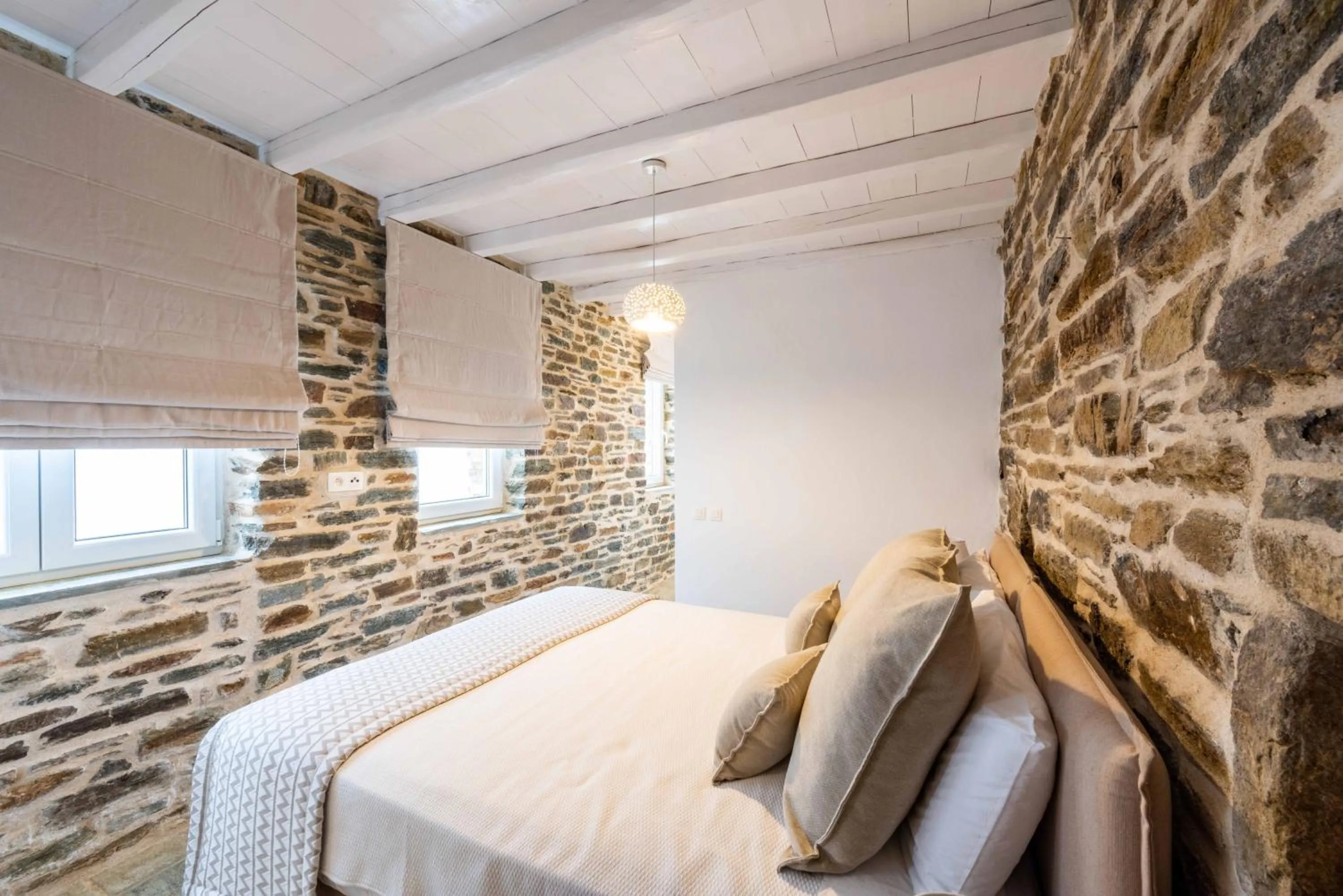 Bed in VATHI BLEU PRIVATE VILLAS