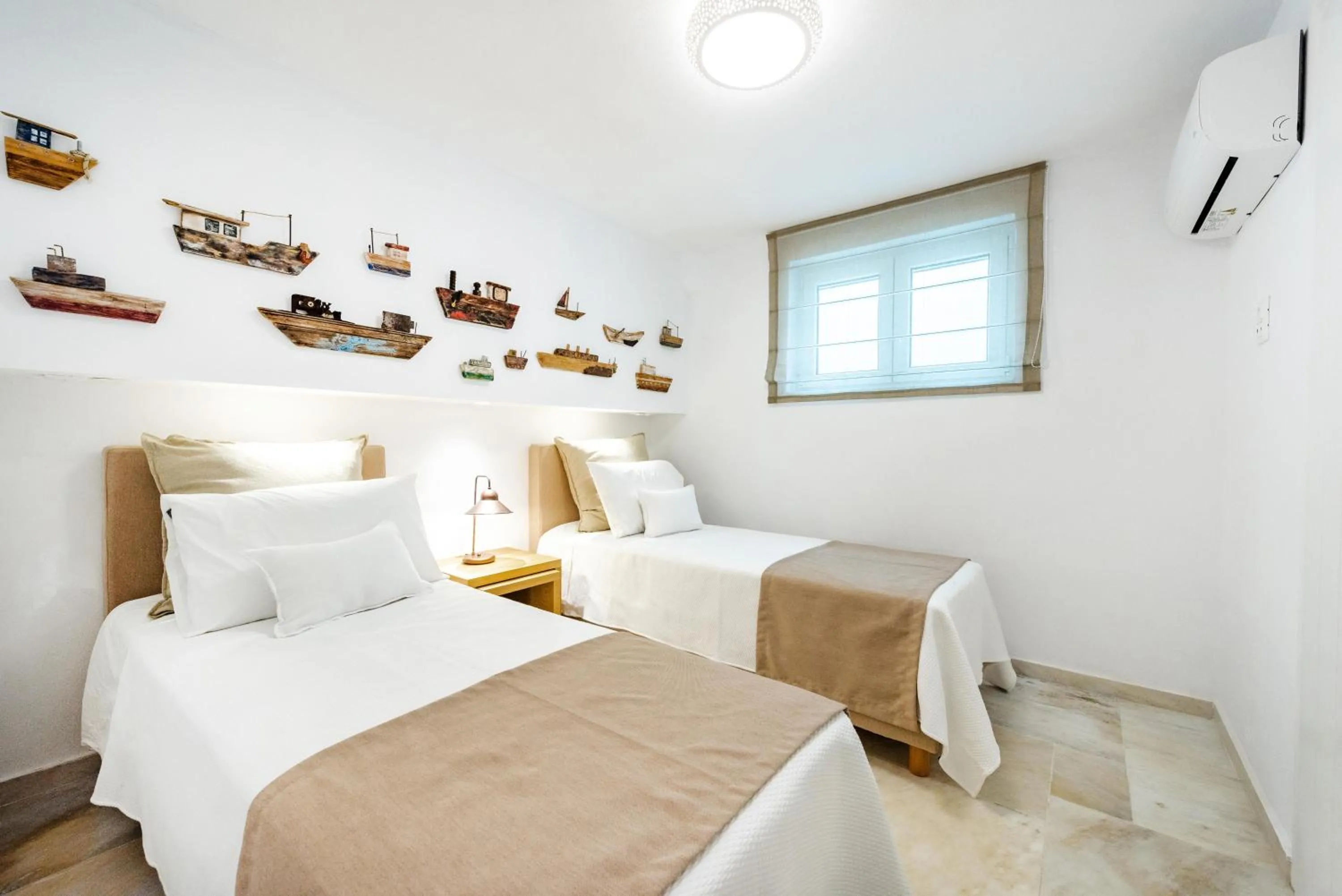 Bed in VATHI BLEU PRIVATE VILLAS