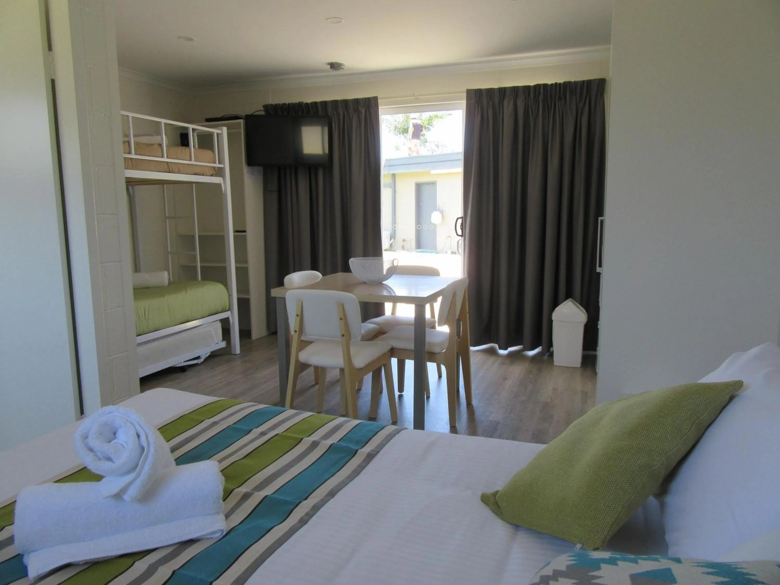 Living room, Bed in Tasman Holiday Parks - Merimbula