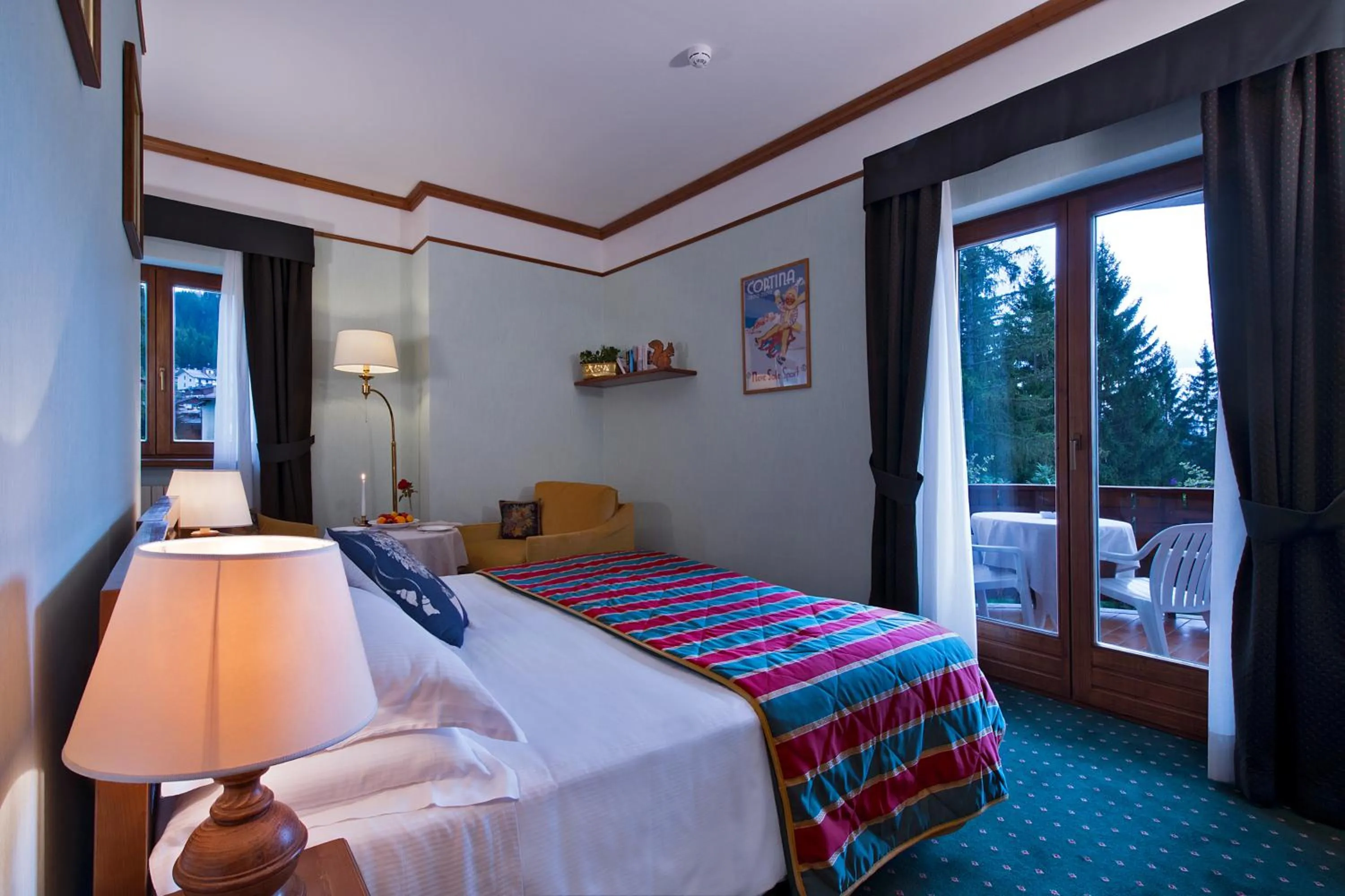 Photo of the whole room, Bed in Boutique Hotel Villa Blu Cortina D'Ampezzo