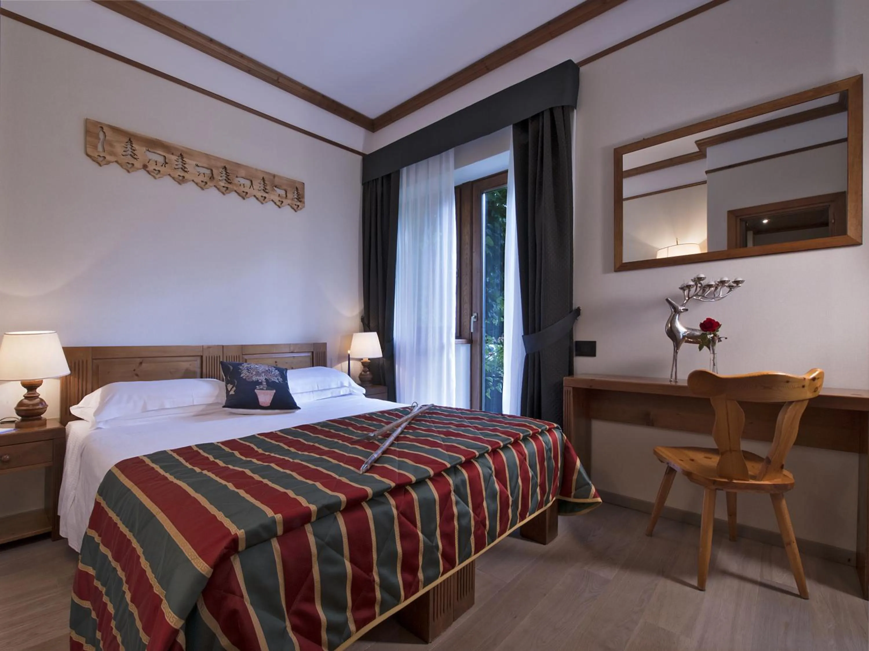 Photo of the whole room, Bed in Boutique Hotel Villa Blu Cortina D'Ampezzo