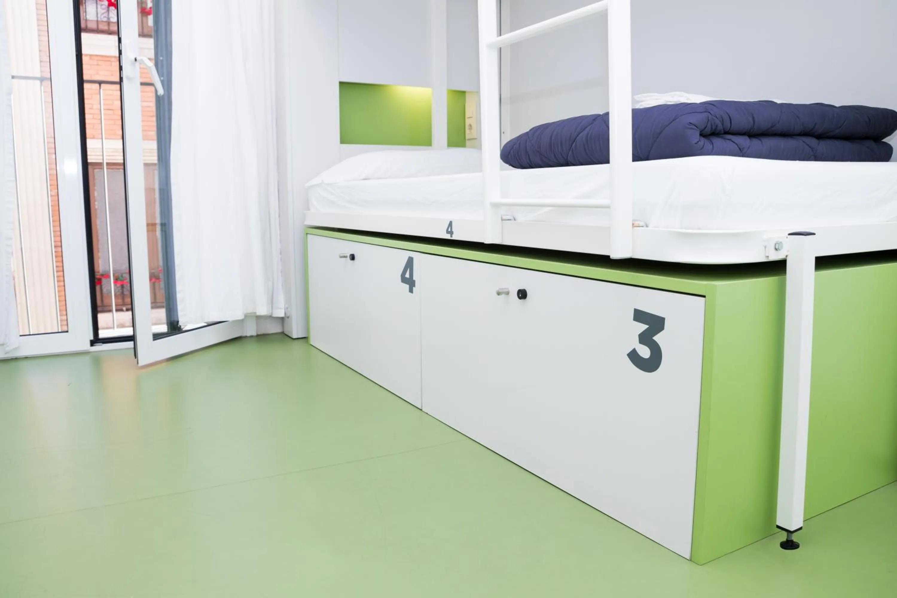 Decorative detail, Bed in Sant Jordi Hostels Gracia