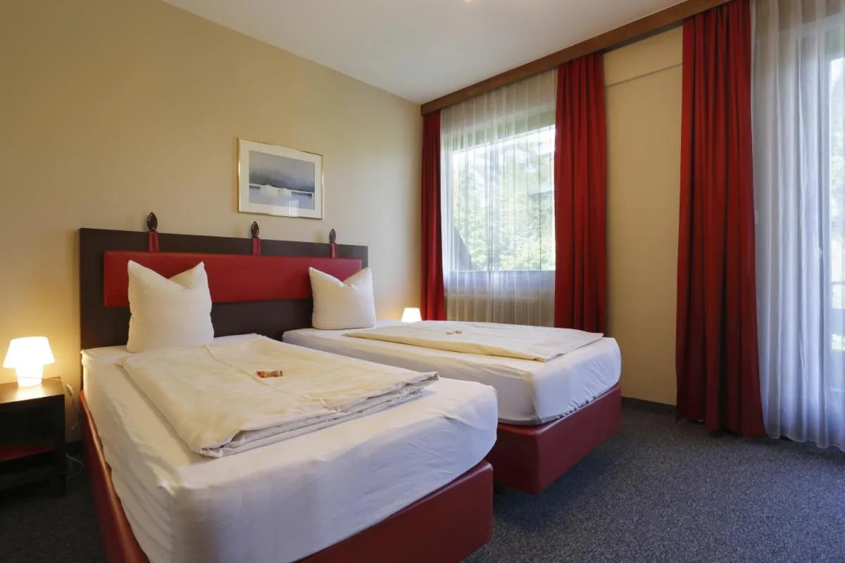 Bedroom, Bed in Alpen.Adria.Stadthotel