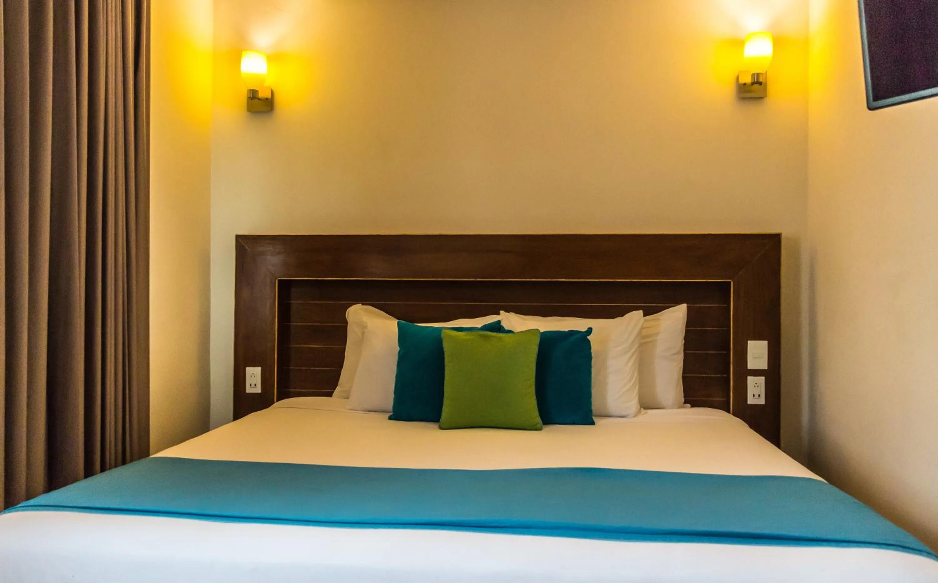 Bed in Aquastar Unique Hotel & Apartments Mahahual