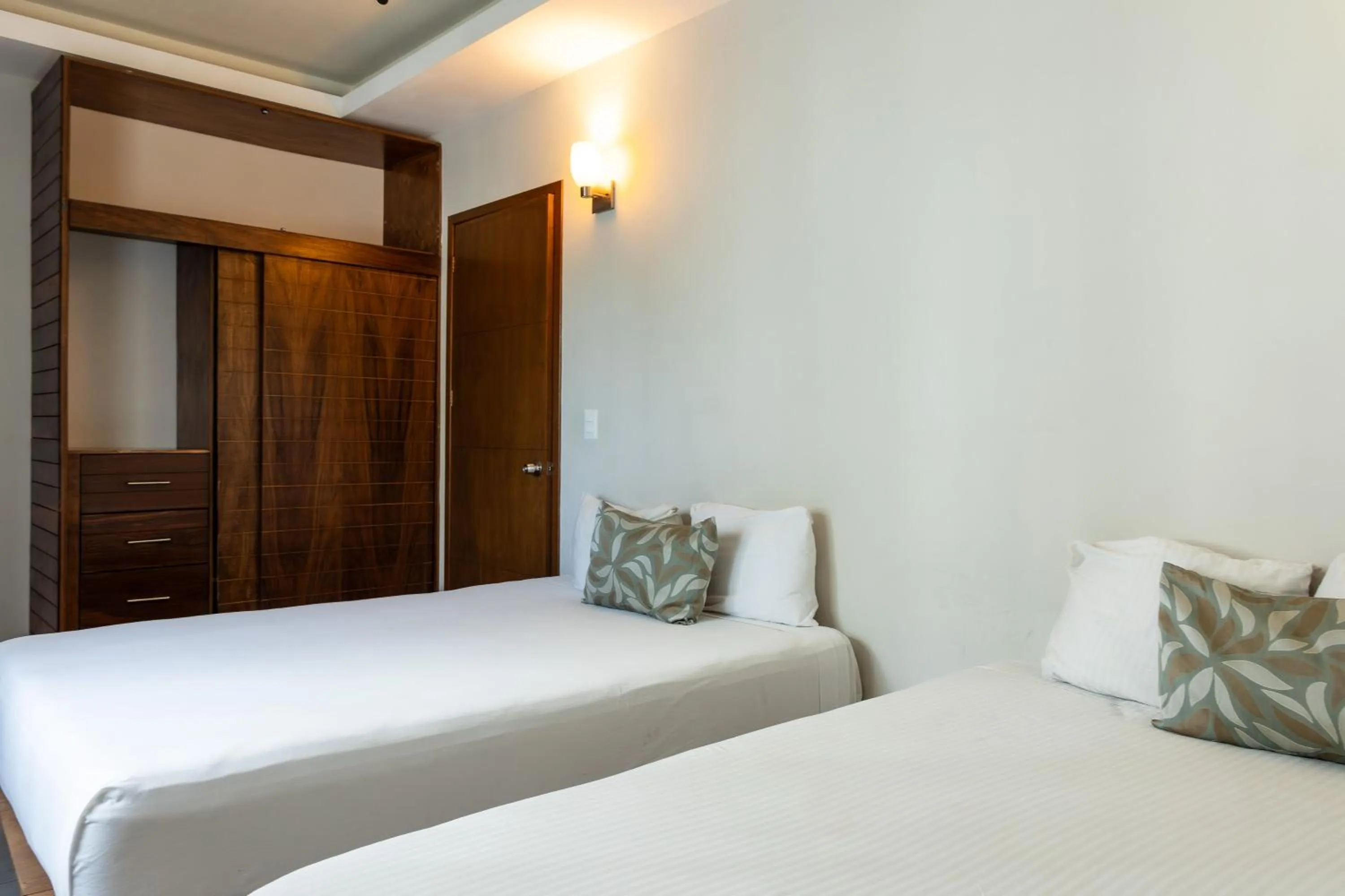 Bed in Aquastar Unique Hotel & Apartments Mahahual