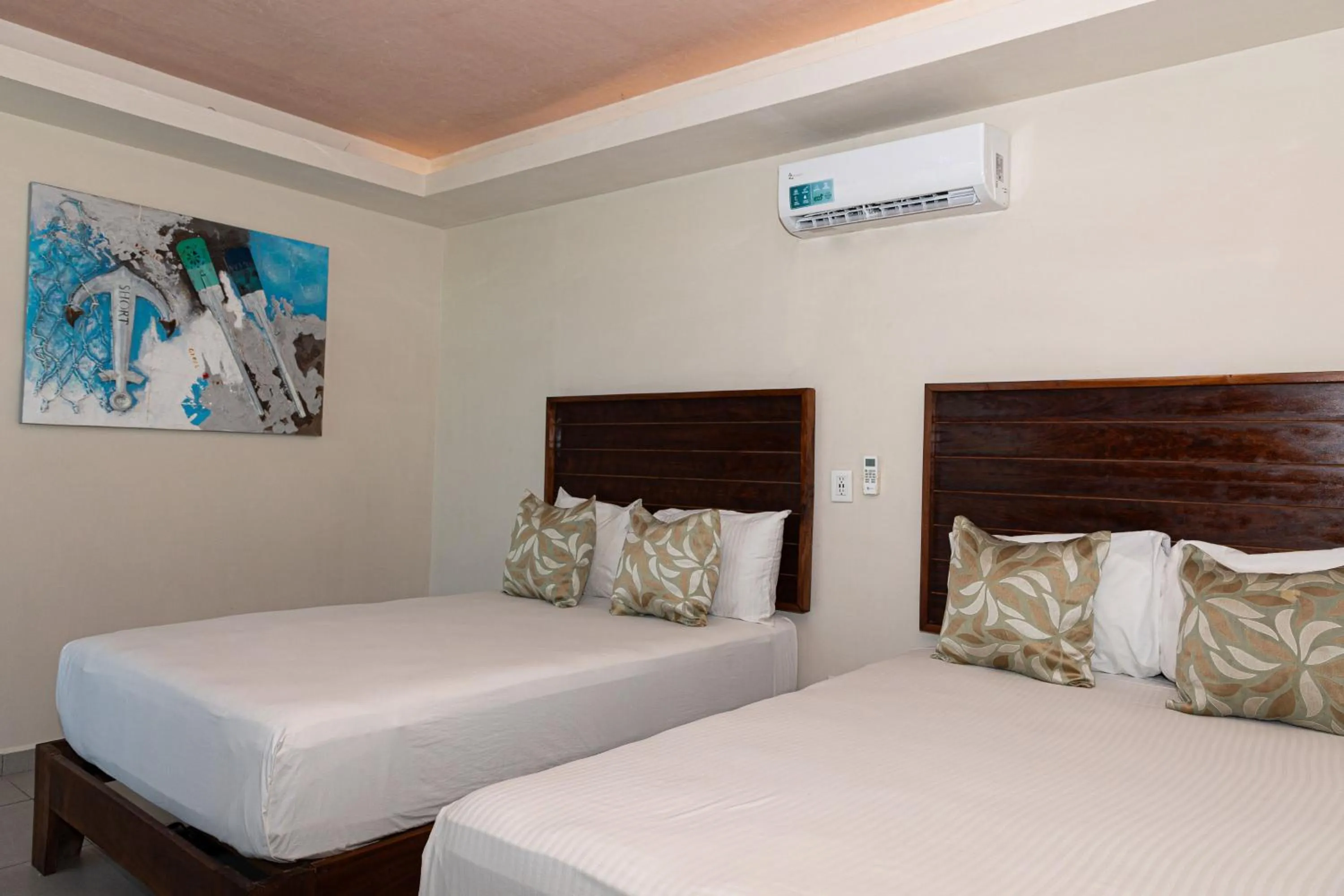 Bed in Aquastar Unique Hotel & Apartments Mahahual