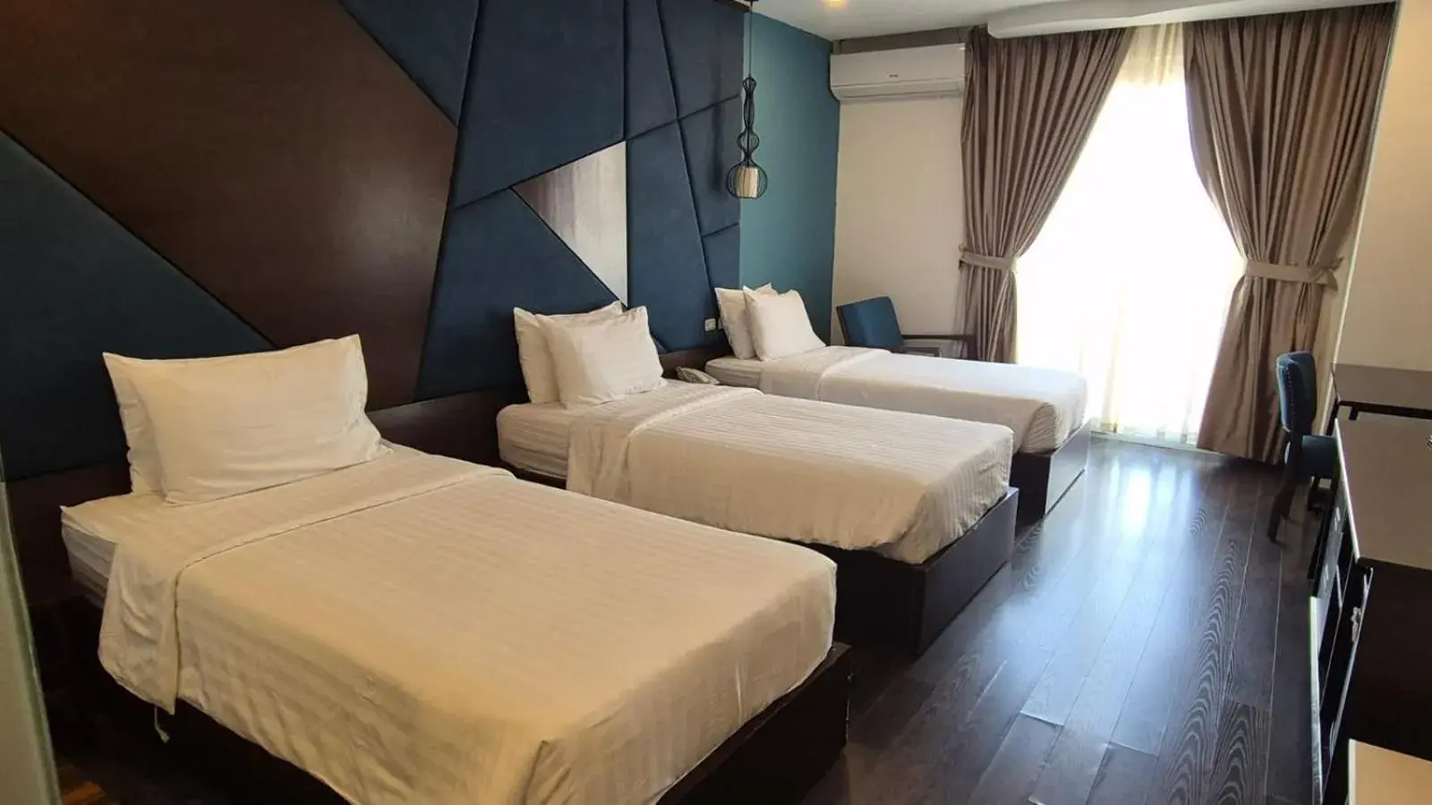 Bed in Azalea Parkview Hotel Bed in Azalea Parkview Hotel