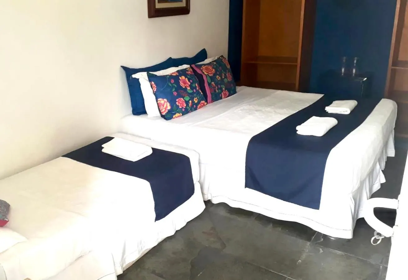 Photo of the whole room, Bed in Pousada Mainá