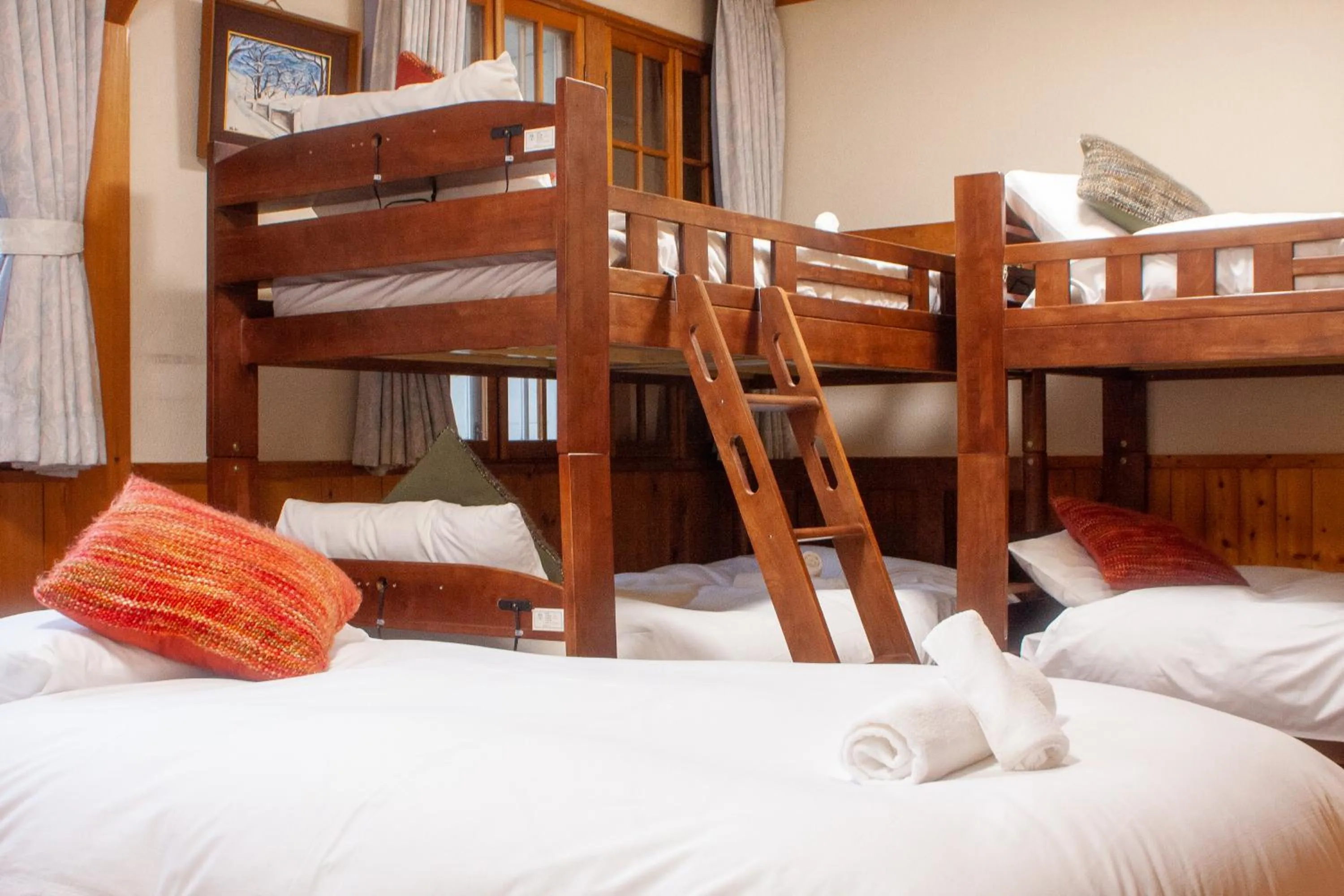 Bed in Kizuna Lodge & BBQ Centre